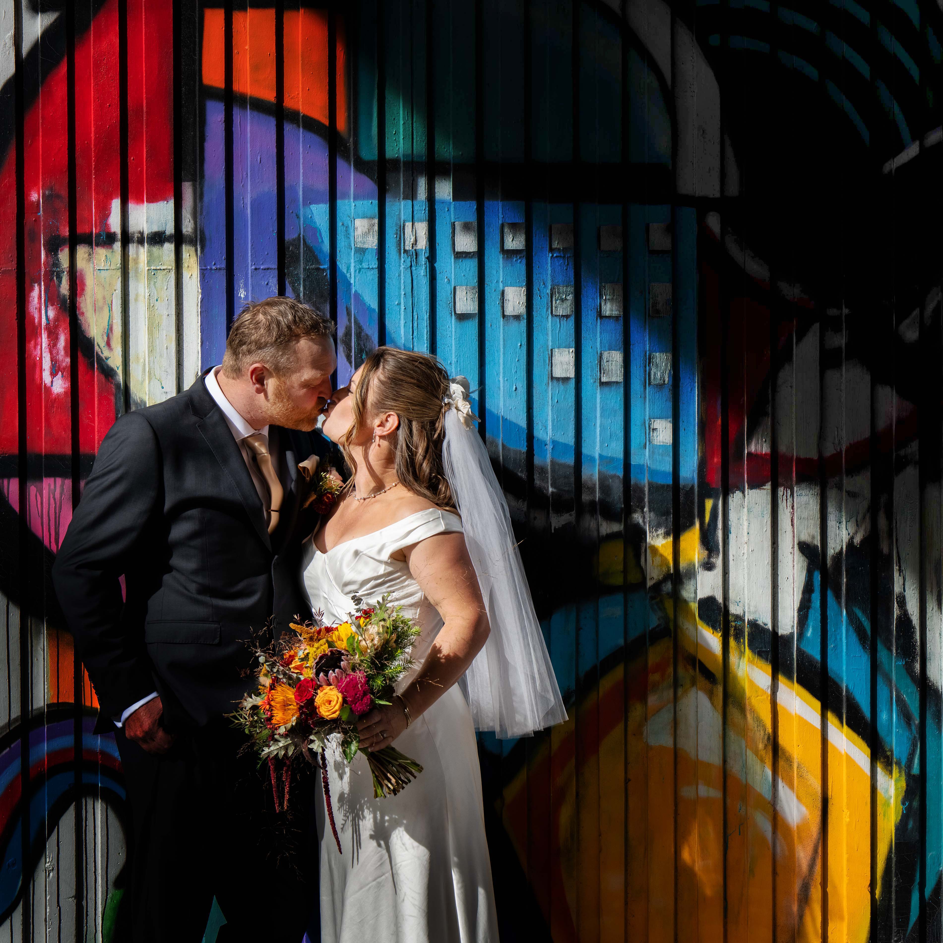 Dave & Sonja bringing a little cinematic magic to the streets of Dunners.
I loved the contrast of this moment; soft connection against the bold colour of street art in Vogel St, shadow and texture. The kind of frame that feels both intimate and alive at the same time.
Weddings don’t always need wide open fields and sunsets. Sometimes a gritty wall, a pocket of light, and two people completely lost in each other is more than enough.
#dunedinphotographer
#dunnerstunner
#dunedinweddings