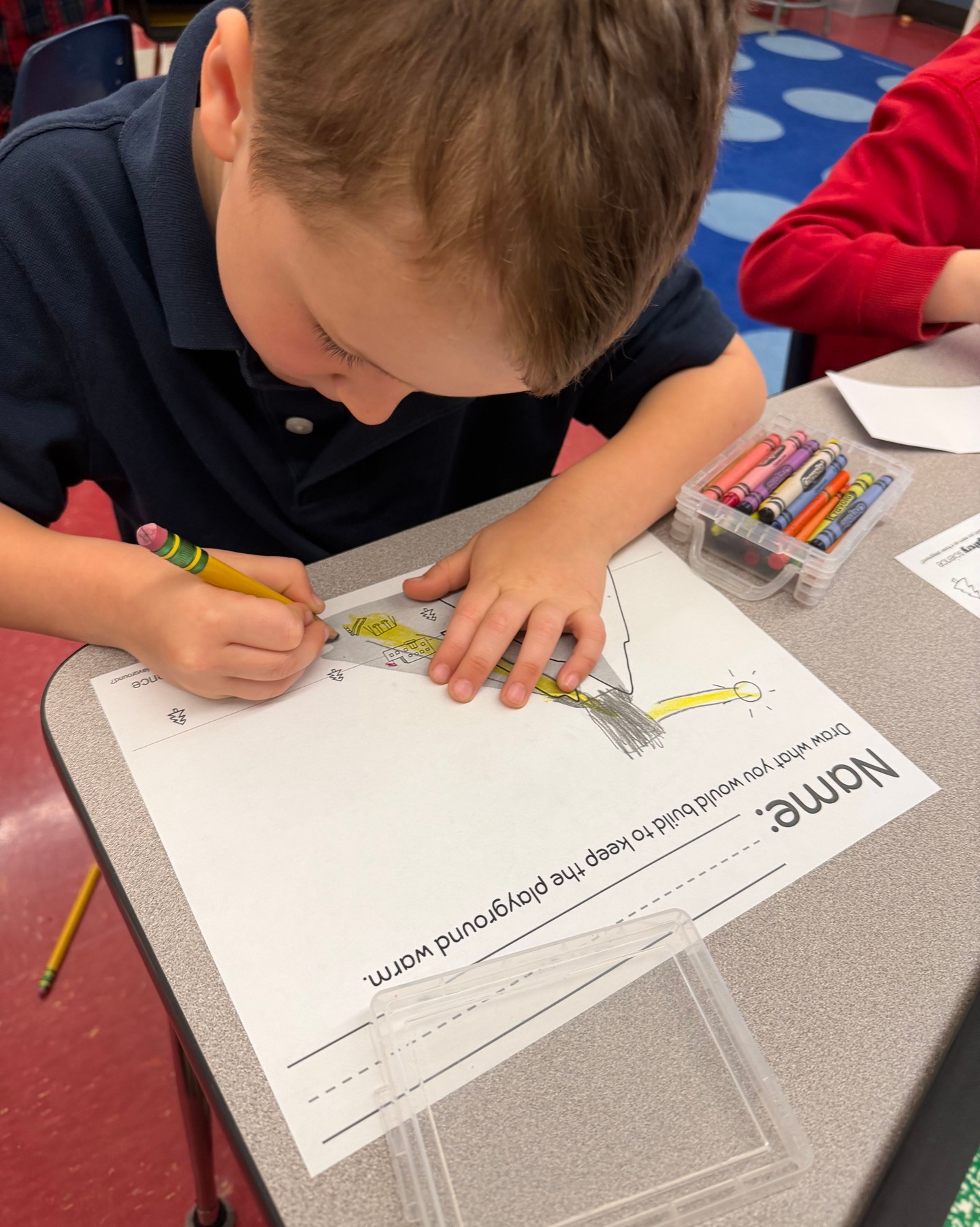 Kindergarten had just started a unit on Sunlight and Warmth ☀️ . In this unit, students made observations to explore how sunlight warmed the Earth’s surface. Students learned that the Sun’s energy heated up pavement and kept us warm. They solved the problem of how to warm a city that did not get any sun in the winter because mountains blocked the sunlight. They used a flashlight as the sun, a paper city and mountain range, foil, plastic, a note card, and construction paper to get the sun to warm up a school playground in the city.