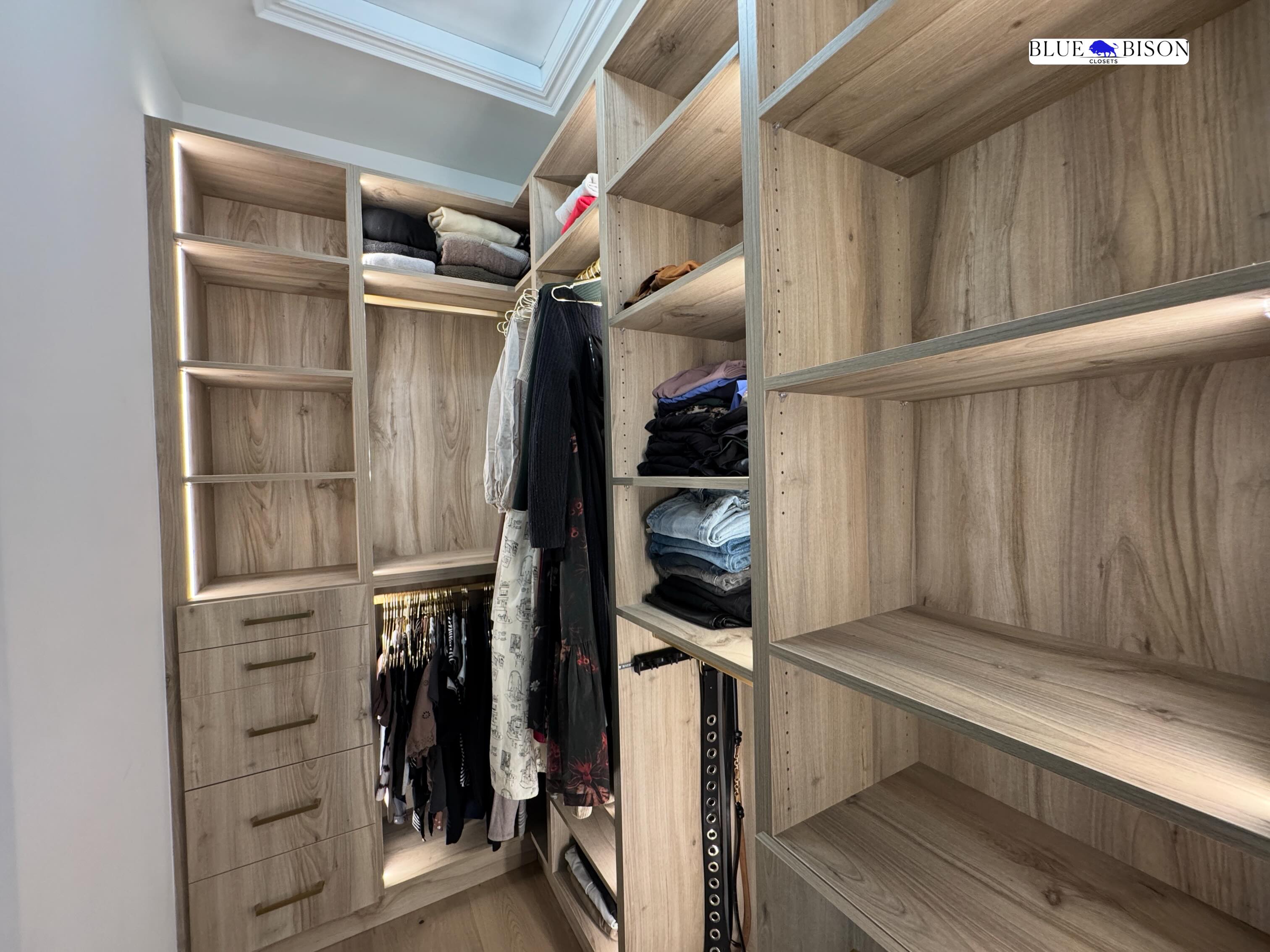 Our client wanted a luxurious look for her master closet ✨
So we went with warm wood grain finishes using Uniboard TFL.
We designed the closet at a full ninety-six-inch height… to create that grand, seamless feel.
Then we added thoughtful details like a built-in laundry basket, gold handles, gold hanging rods, and a belt rack.
And our client absolutely loved it