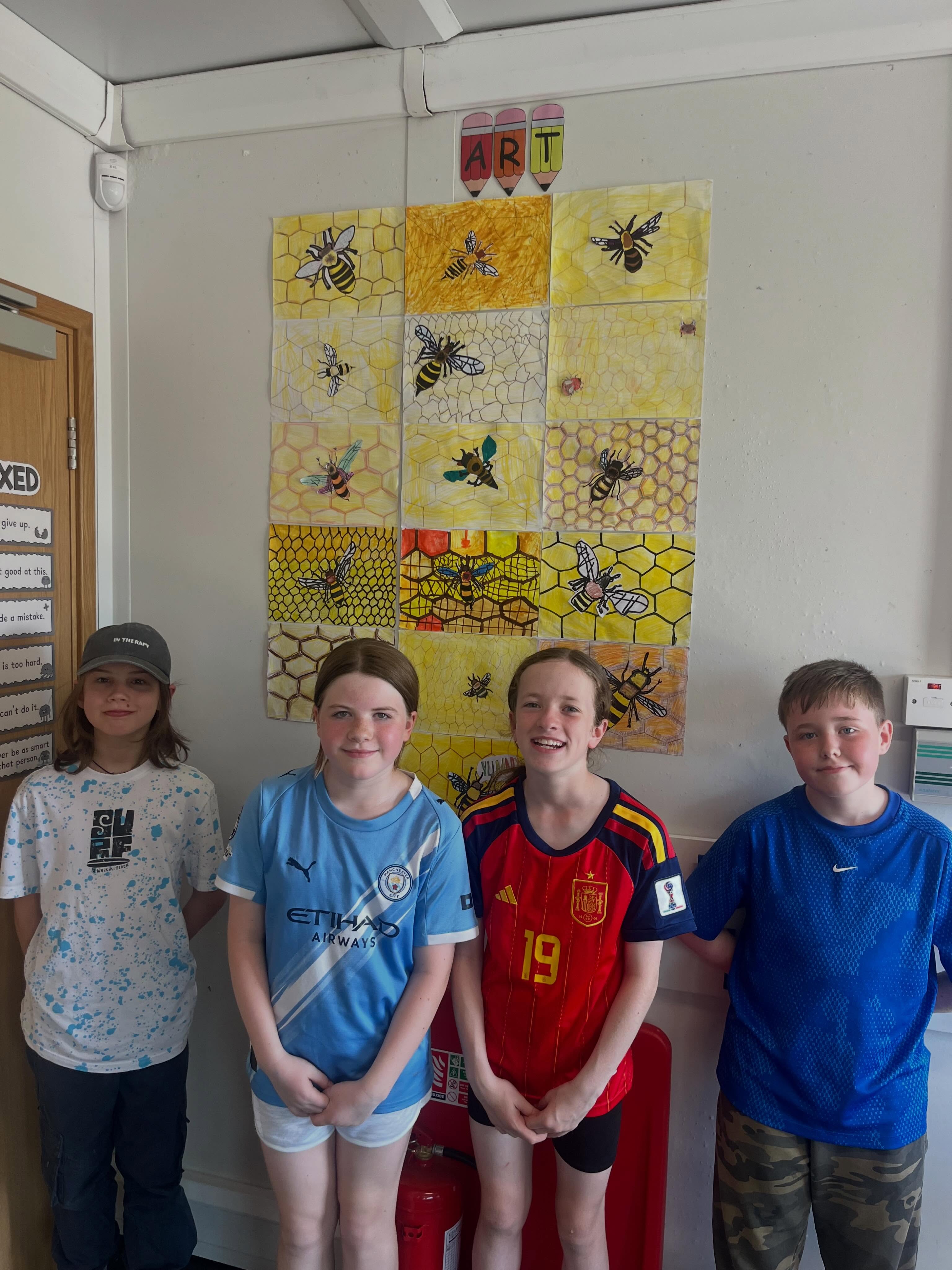 4th class celebrating World Bee Day with some cool art 🐝