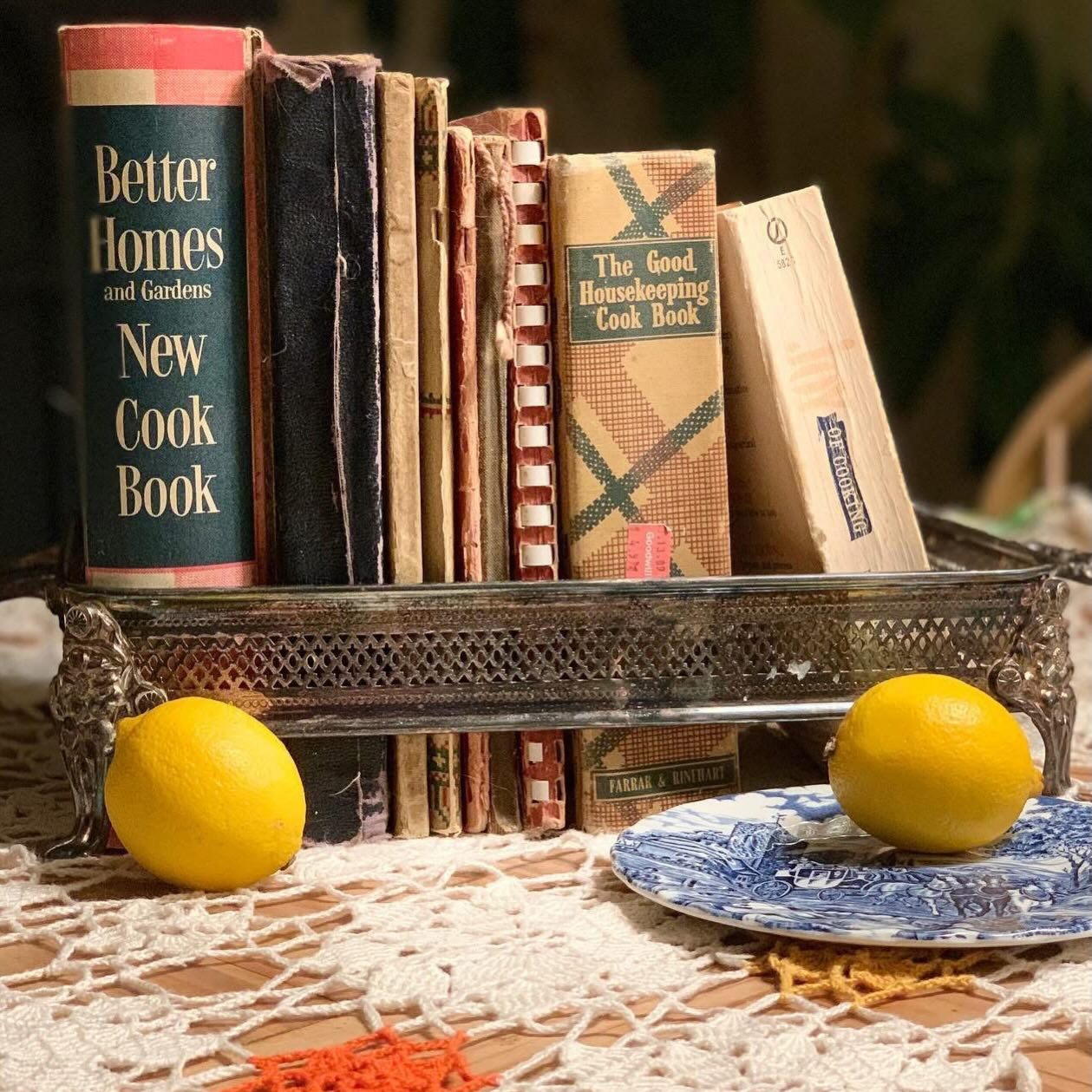 Old family heirloom cookbooks, a vintage crocheted tablecloth, an antique Myott plate and my favourite way to corral books, a vintage silver plate casserole dish holder.
Find the pieces that bring you joy and elevate the ordinary.