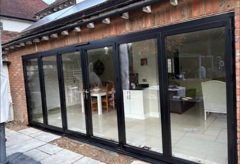 A new project recently completed. We replaced the existing white French UPVC doors and windows with a 5meter set of modern black aluminium bifold doors, including plumbing work, plastering and electrics. This project conpletely transformed the rear of this beautiful home.
The new installation floods the space with natural light while creating a clean, contemporary finish inside and out.
Scroll to the end to see the before! 👉
Our showroom will be closed next week from Saturday to for a week due to annual leave. We reopen as usual on Monday the 8th.
In the mean time our glass shop on Lower Road will be open as usual.
If you have any enquiries please send them over to our email and we look forward to picking up on these on our return.
📧 showroom@gxhomeimprovements.co.uk
📞01753 892128
#GXHomeImprovements #BifoldDoors #AluminiumDoors #HomeTransformation #BeforeAndAfter