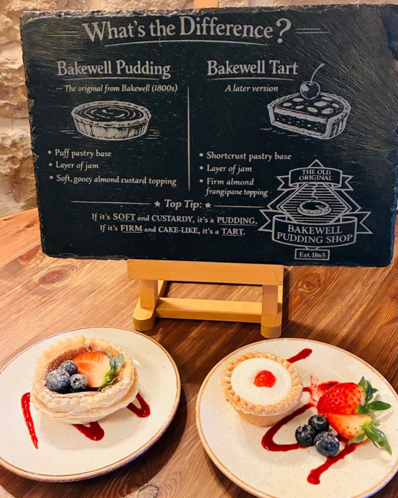 Do you know the difference between a Bakewell Pudding and a Bakewell Tart? 🤔✨
Our iconic Bakewell Pudding is the original recipe dating back to the 1860s 🇬🇧💫 It was actually meant to be a strawberry jam tart, but a happy accident changed everything! Instead of mixing the egg and almond mixture into the jam, it was layered over the top! Creating a puff pastry base, a rich layer of jam, and a beautifully soft almond topping 💛
The Bakewell Tart came a little later and is just as delicious 😍 It features a shortcrust pastry base, a layer of jam, and a firm almond frangipane topping! Either finished with icing and a cherry 🍒 or a flaky almond topping for that perfect cake-like bite 🎂✨
Whichever you prefer, you can always count on us to serve them fresh in our café ☕🍰, from our gift shop 🎁, or deliver them straight to your door anywhere in the world 🌍📦!
Give us a visit this summer or shop online using the 🔗 in our bio!
#originalbakewellpudding #theoldoriginalbakewellpuddingshop #supportlocal #visitbakewell
