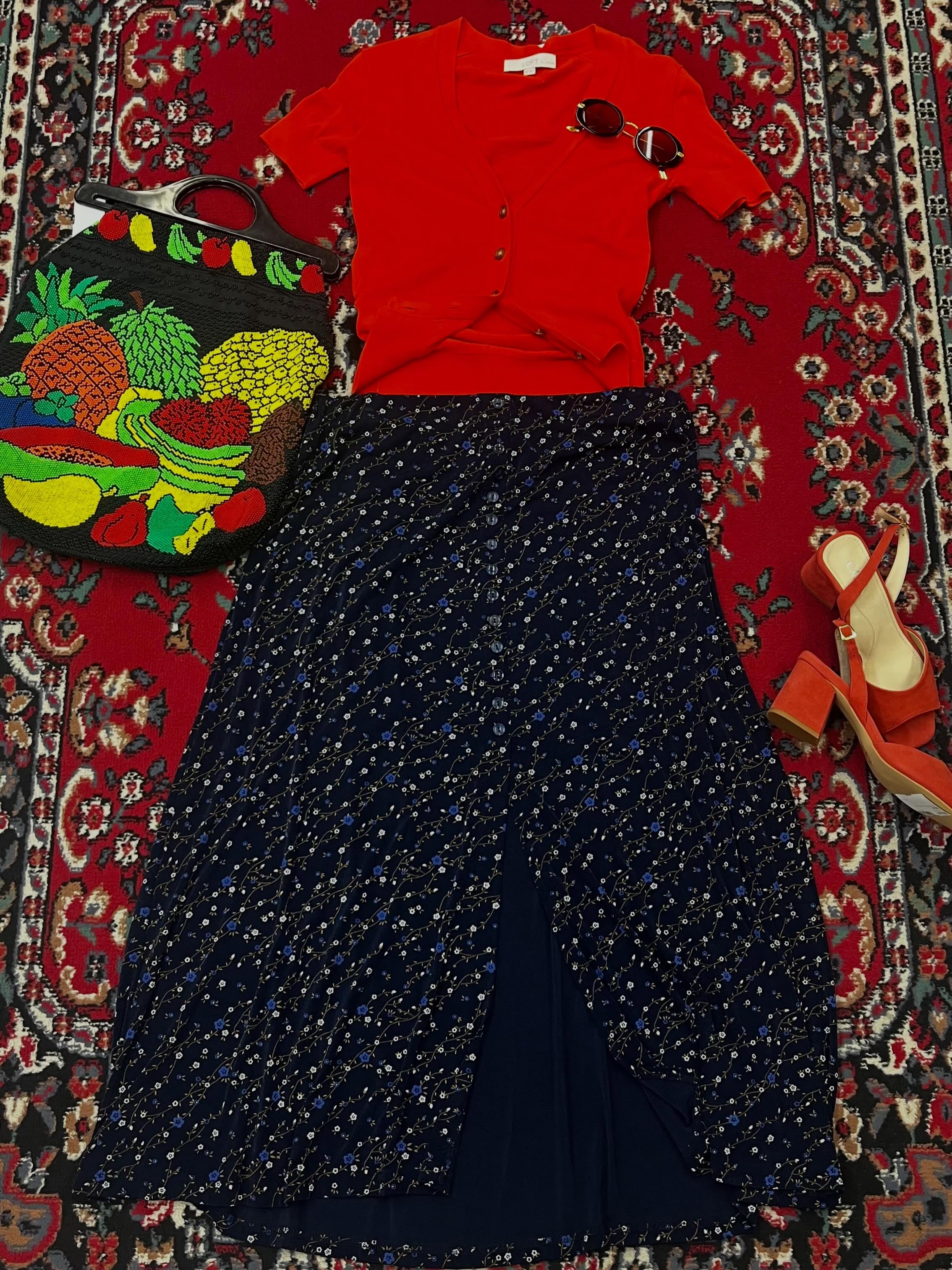 I’m wicked sorry to tease you with this fruit purse because it sold literally minutes after we took these photos, but you just have to see how cool it is!!! Love the orange pops with this look 😍 by Sara-Ann. #couchsaleswithldr #ldrstaffpicks
DETAILS:
calla coral chunky heels 37- 21.00
sunnies- 21
loft orange short sleeve cardigan xsp- 8.00 clearance
vintage beaded fruit purse- SOLD!
vintage blue floral slinky skirt xlp- 18.00