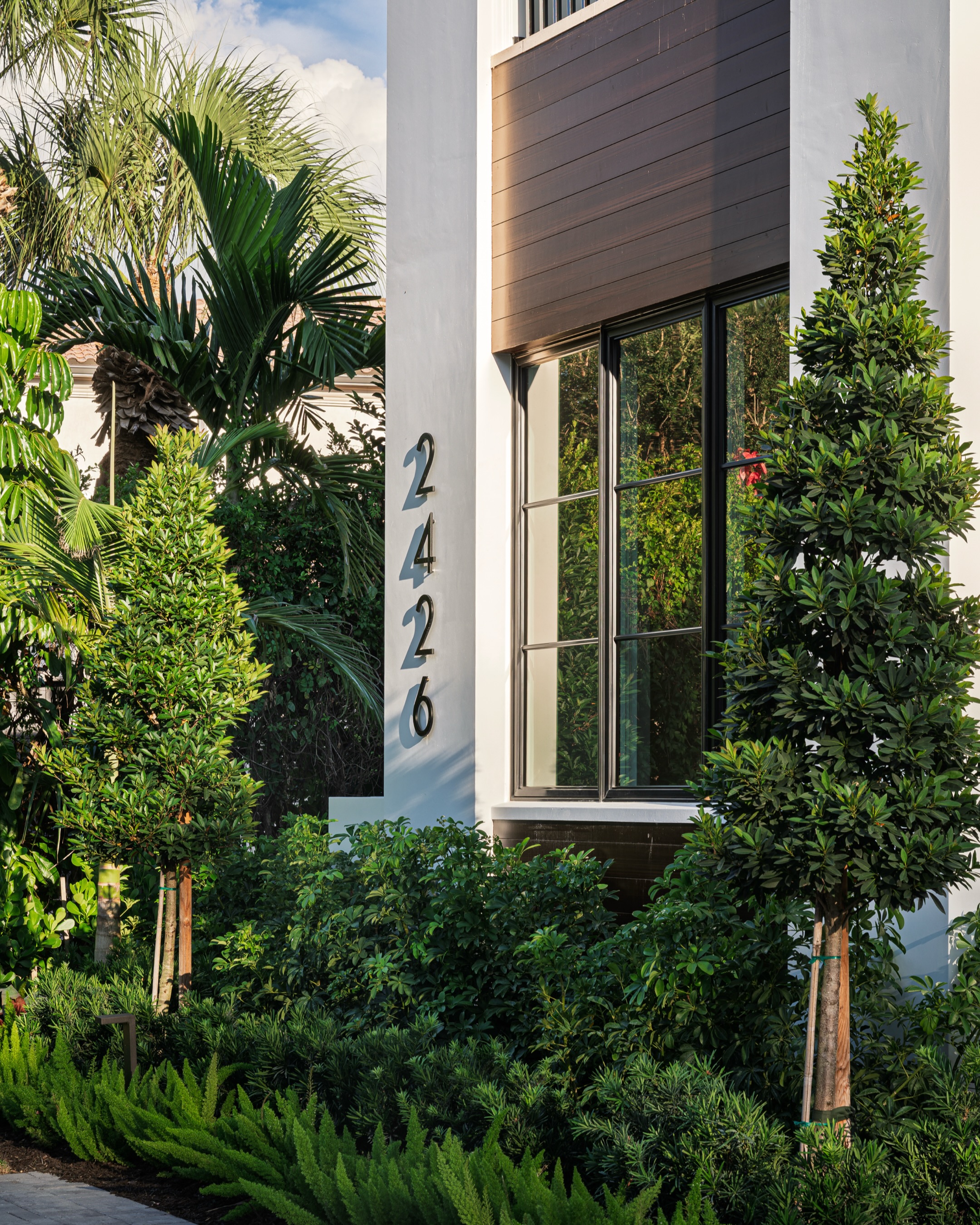 Sunlit architecture framed by layered tropical planting. 🌴
Designed to complement the home’s clean lines and warm material palette, this landscape balances structure with softness through textured greenery, sculptural palms, and low layered planting that creates a refined sense of arrival. Every detail was considered to make the home feel connected to its environment from the very first approach.
#LuxuryLandscapeDesign #TropicalModern #LandscapeArchitecture #OutdoorLiving #ModernLandscape