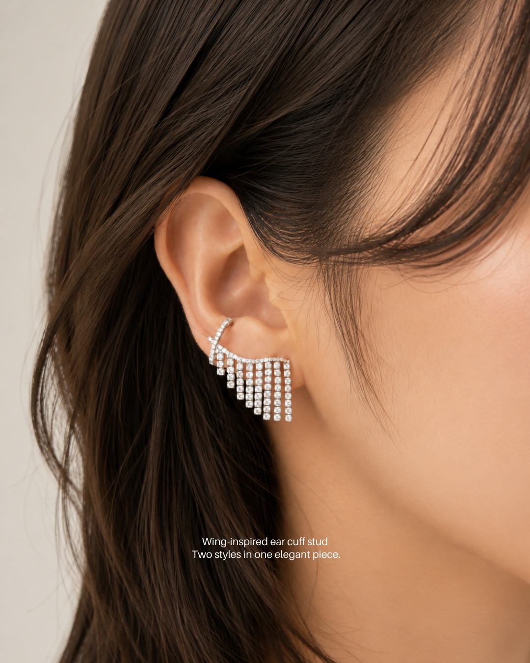 925 silver wing-inspired ear cuff stud with sparkling stone details.
A unique design that combines an ear cuff and stud earring in one piece.