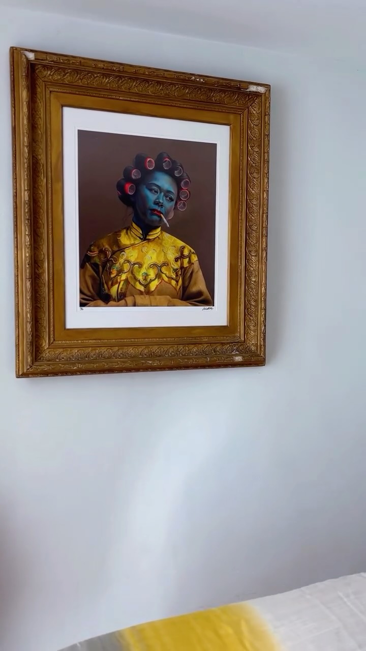 One of the great pleasures of sourcing lies in uncovering unexpected pairings.
Recently, we acquired this signed limited-edition print, Chinese Girl (from Croydon) by Mark Denton, for a client and immediately sensed it called for something exceptional. Rather than placing it within a contemporary frame, we chose an ornate late Victorian example. More than a century separates the two, yet together they establish a compelling dialogue between heritage and modernity.
The playful irreverence of Denton’s portrait is beautifully heightened by the grandeur and craftsmanship of the antique frame, each enriching and reframing our experience of the other.
It is a reminder that the most captivating interiors are seldom composed of perfectly matched pieces. Instead, they are shaped through contrast, layered narratives and unexpected juxtapositions.
Sometimes the right frame does more than hold an artwork; it becomes an integral part of its story.
Sourced by Terrou Studio | The Lost. Found.
.
.
#CuratedInteriors, #CollectedHome, #InteriorInspiration #ArtCollector #BritishArt
