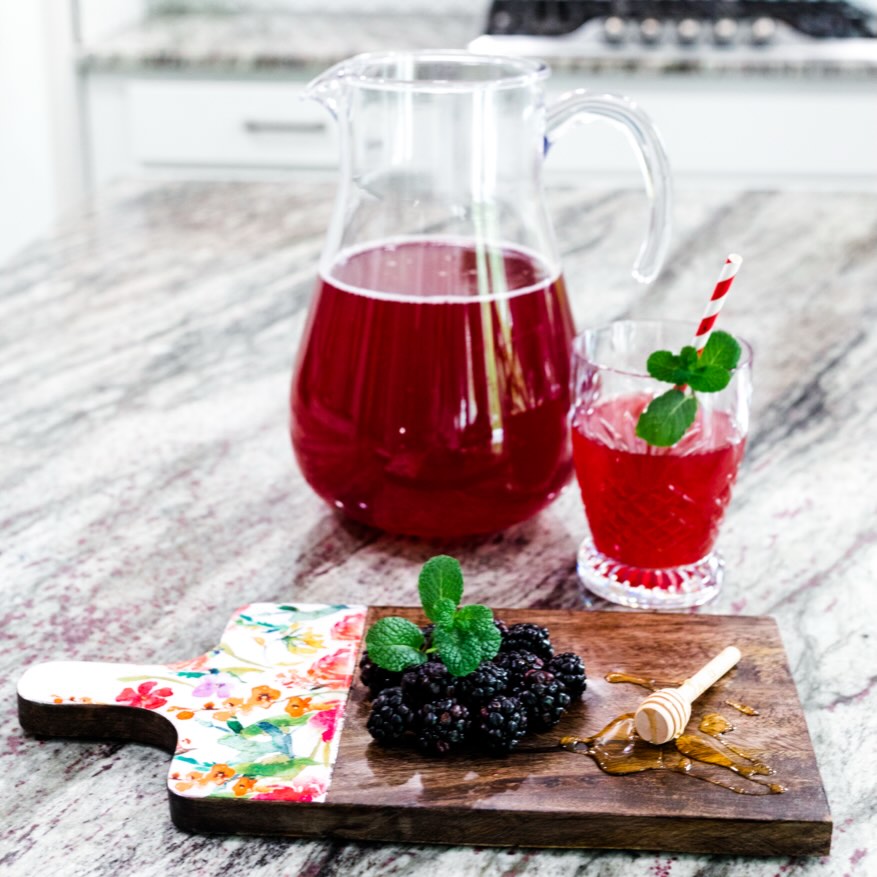 Sweet summertime is on it's way and with that comes warmer days and more time spent outside! Cool off with my refreshing, fruity and slimming blackberry and honey iced tea while you soak up the sunshine! It is loaded with flavor and antioxidants and it is quick and easy to make! It is the perfect pick me up on a hot day! Give it a try!
Ingredients:
8 cups of water
8 bags of organic green or peppermint tea
1 tsp of vanilla extract
1 cup of organic blackberries
1/2 cup of blackberries to garnish
1/2 cup of raw, organic honey
Directions:
In a medium pot, add in all of the above ingredients to a large pot and set it on the stove at medium to high heat. Then, once it has been brought to a boil turn the tea down to the lowest setting and allow it to steep for an additional ten minutes. Once that is done, pour the tea into a pitcher and place it in the fridge for four hours or until chilled. Serve it over ice with two to three raspberries and a mint leaf to garnish. Enjoy! ☀️ #blackberrytea #icedtea #sweetsummertime #livehealthywithlaura