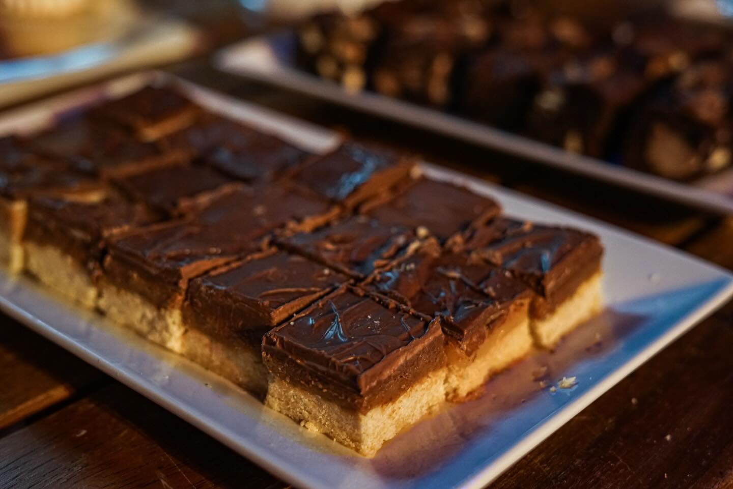 Millionaires shortbread, how we love you - all your delicious caramel layered on a sweet butter biscuit casually covering yourself in chocolate. I’ve had ONE booking without these beautiful bakes in the last 10 years. One. What can I say, they’re just too good to leave off the menu whether it’s a wedding to remember or a big birthday bash.
Want some of your own as part of your Dessert Table? Step right this way to the link in our bio to see our full Dessert Table menu 👉