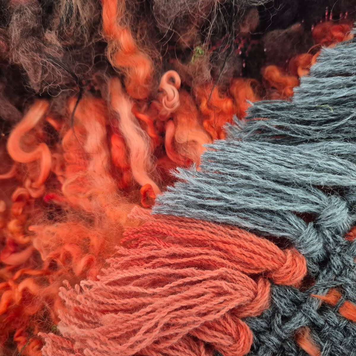 I have been researching historic examples and mentions of Irish mantles, known as bratts, and have been excited to read about mantles with fine wool or silk fringes all around the edges in a contrasting colour.
In the Irish epic "Tain Bo Cuailnge", the King of Ulster Conchobor is said to wear a purple-fringed bratt that wound around him five times! Elsewhere, the saga mentions a black mantle with a purple fringe, and a dark grey mantle with a gold fringe.
As such, I've decided to add some glamorous grey and red fringing to my red Cloonshannagh-inspired cloak. What do you think?
#weaver #handwoven #irishweaving #irishcloak #vararfeldr #bratt #heritagecraft