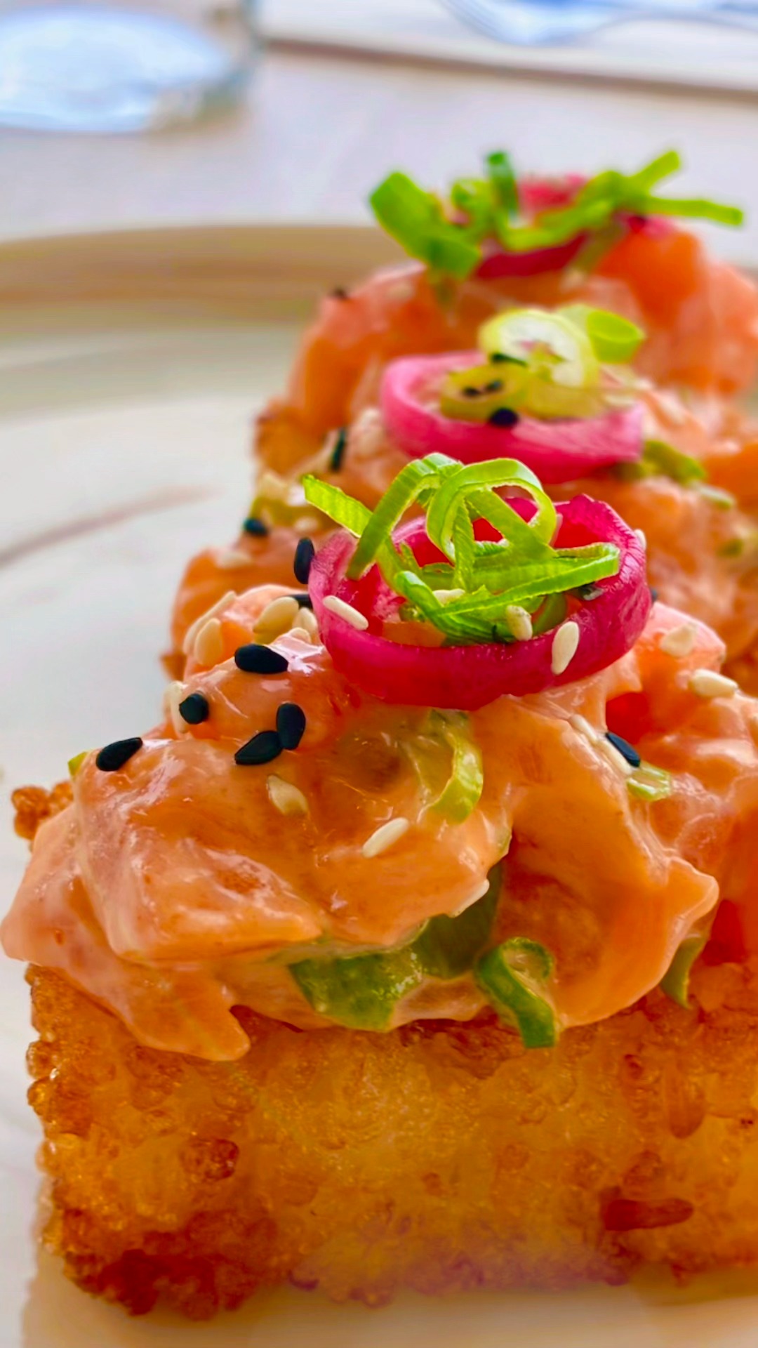 Crispy rice cakes, organic salmon, spicy mayo, pickled ginger & scallions. A crunchy, creamy, spicy feast for the senses.
#AchillesBermuda #BermudaEats #NewMenu #SummerMenu #SummerEats #BermudaFoodie #CrispyRice #RiceCakes #SalmonLovers #SalmonCrispyRice #SushiLovers #SeafoodLovers #BermudaDining #AchillesMoments #LetsSunset