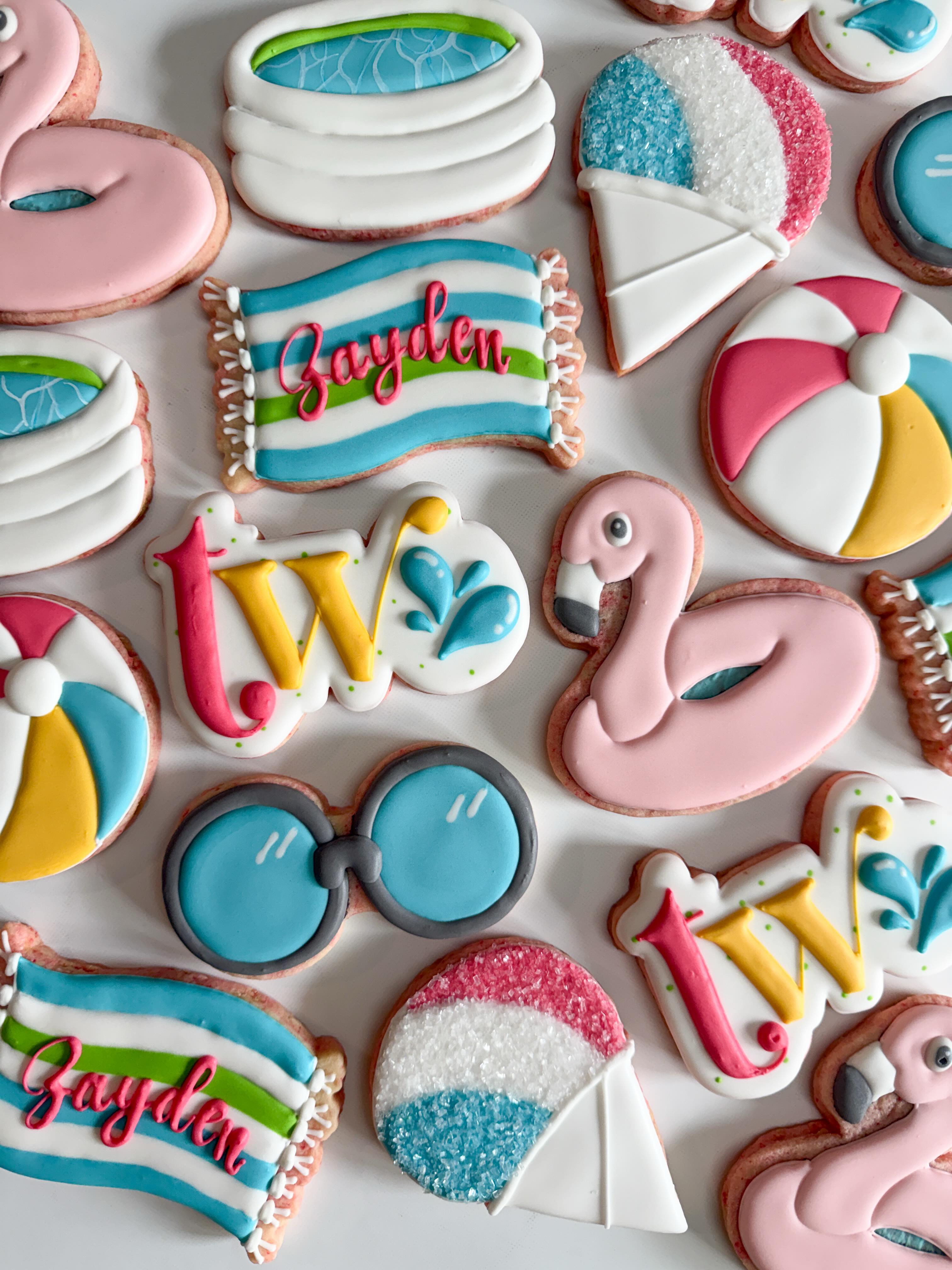 "Two the Pool” for Zayden’s birthday celebration! Beach balls, snow cones, and flamingo floaties – what could be better on a hot Nebraska Saturday?
#decoratedsugarcookie #customcookies #nebraskacookier #summercookies #birthdaycookıes