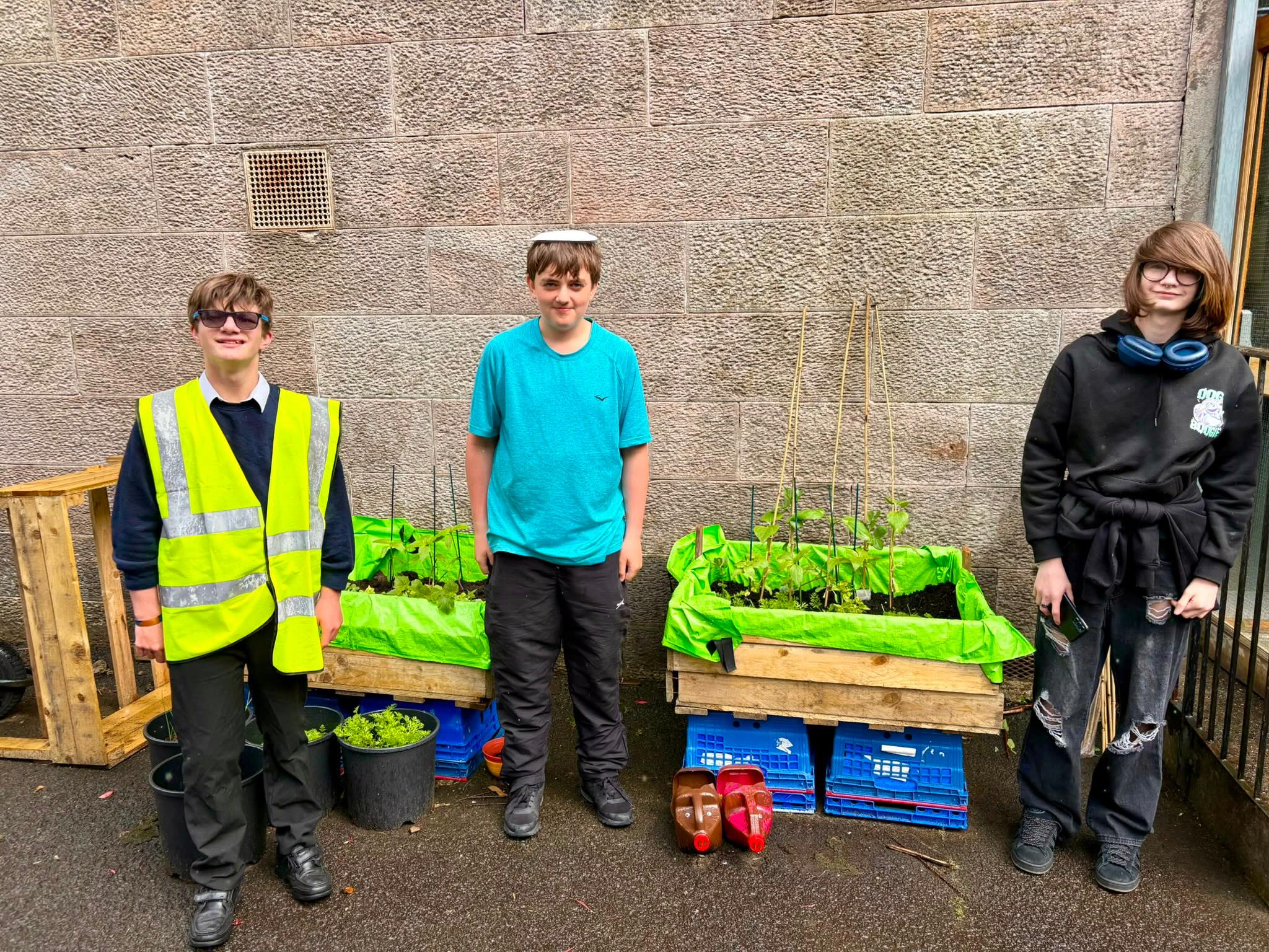 Our eco committee checking out how the plants and veg are growing today #learningforsustainability #growyourfood #ecoschool #outdoorlearning