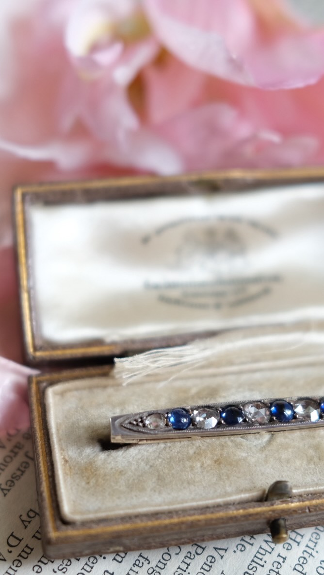 The colour of a summer evening sky, captured in sapphire.
Between them, rose cut diamonds flicker like candlelight, their faceted surfaces reflecting light with a softness modern cuts rarely possess.
Set in silver and 15ct gold and accompanied by its original fitted box, this antique line brooch has all the romance of a forgotten love letter pressed between the pages of a favourite book.
Now available at Terrou.com.
.
.
#AntiqueJewellery #ForgottenTreasures #RoseCutDiamonds #SapphireLovers #ObjectsWithStories