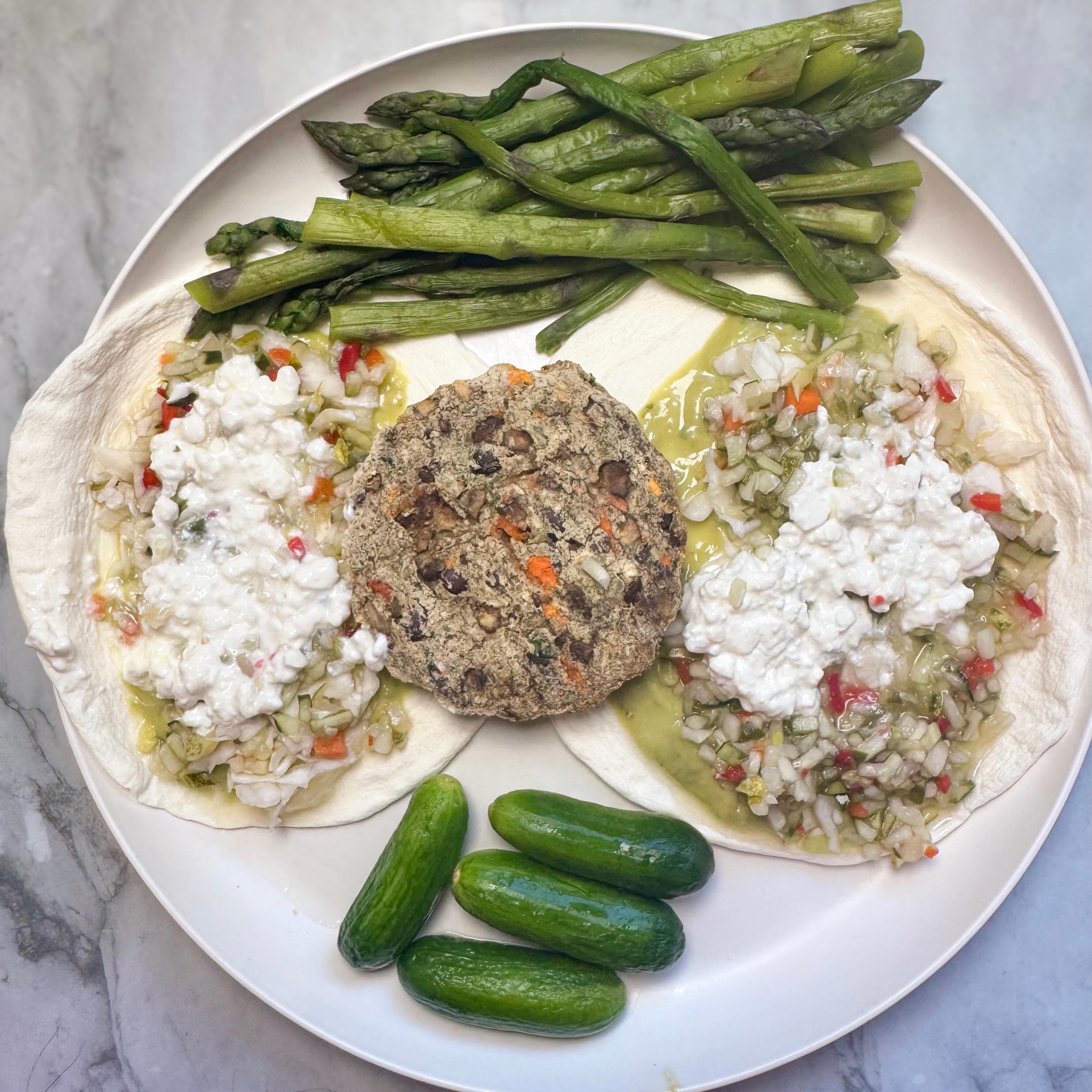So many food holidays to celebrate today & one of my favorites is a good veggie burger ( like an actual veggie burger not fake meat!)
I’ve recently been obsessed with @actualveggies veggie burgers for a way to get in different veggies in a different format! I love this mushroom quinoa one and it’s also a great source of some carbohydrates with the quinoa. I can’t wait to try more of their flavors soon.
Last summer, I had mushroom mozzarella & chipotle cheddar from a giveaway win! Will see what other flavors I buy next store run since I finished my box of these at home!
I love to use @egglifefoods wraps as a base & top my veggie burgers with @good_culture cottage cheese for extra protein!
I was out of almost all fresh veggies so I loaded up on these @grillospickles pickle de gallo, @traderjoes guacasalsa, @clevelandkitchen mayo-free coleslaw, asparagus spears from @traderjoes ( best frozen veggies 💯) and the rest of the cucumbers I had!
#nationalveggieburgerday #veggieburger #proteinhack #healthyeats #foodie
