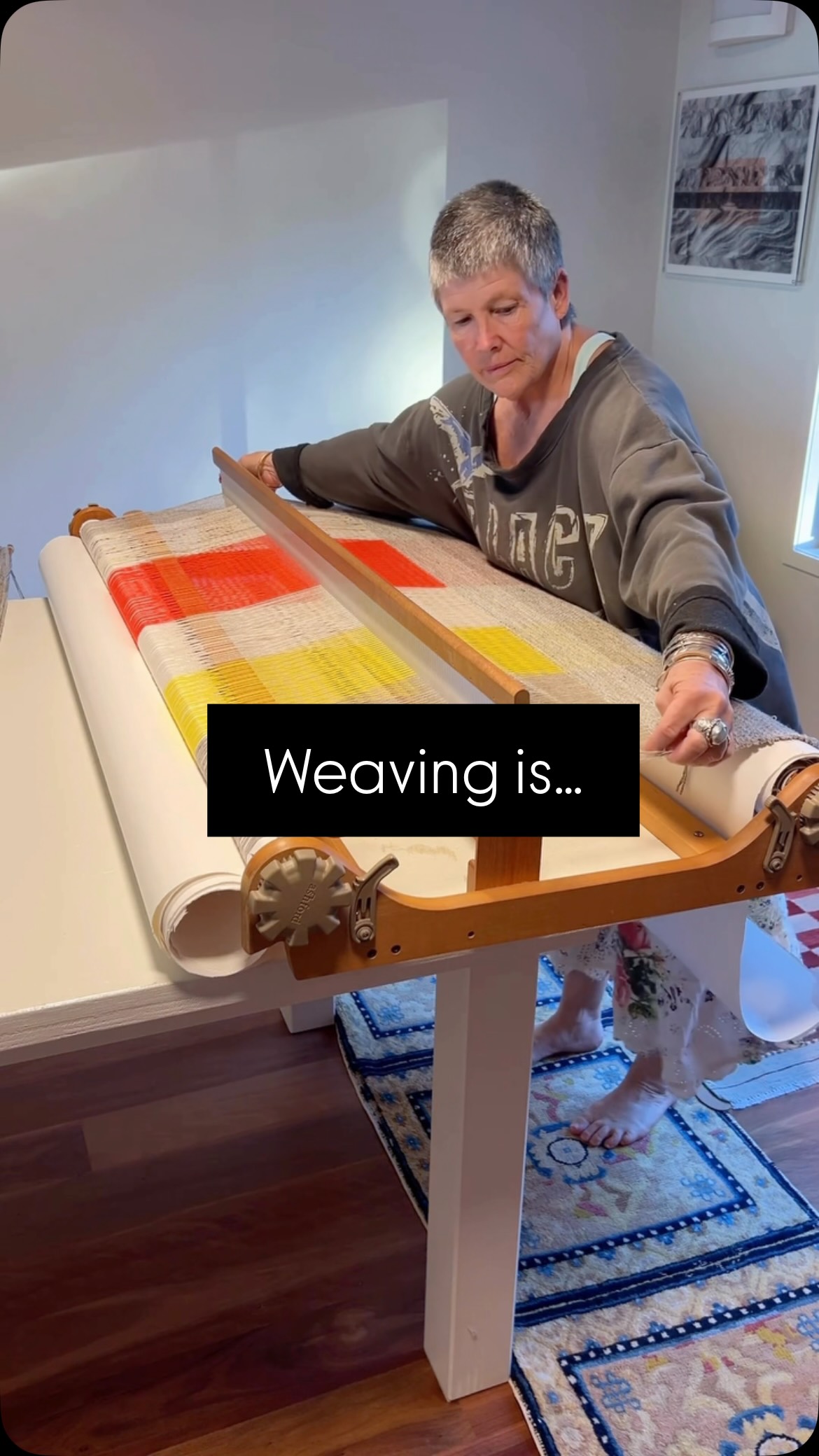 Here I’m weaving with my rigid heddle loom, where I stand and walk rather than sitting to weave my artisan handwoven blankets, all based on my experiences travelling the world.
Watch to find out more about a ‘pick’ and PPI.. and how the sloooooow process of repetitively moving the shuttle from side to side, creates beautiful items which bring comfort and warmth.
I respect and value the traditions of hand weaving, and enjoy feeling my feet and repetitive steps on these beautiful handwoven rugs from @the_rug_shop
If you’ve found this interesting, love for you to share and repost with your friends. Come follow me on my weaving journeys. Link in Bio.
New Series pieces available soon!
#artisanmade #weaver #handwovenluxury #uniquegiftideas #madebyhand