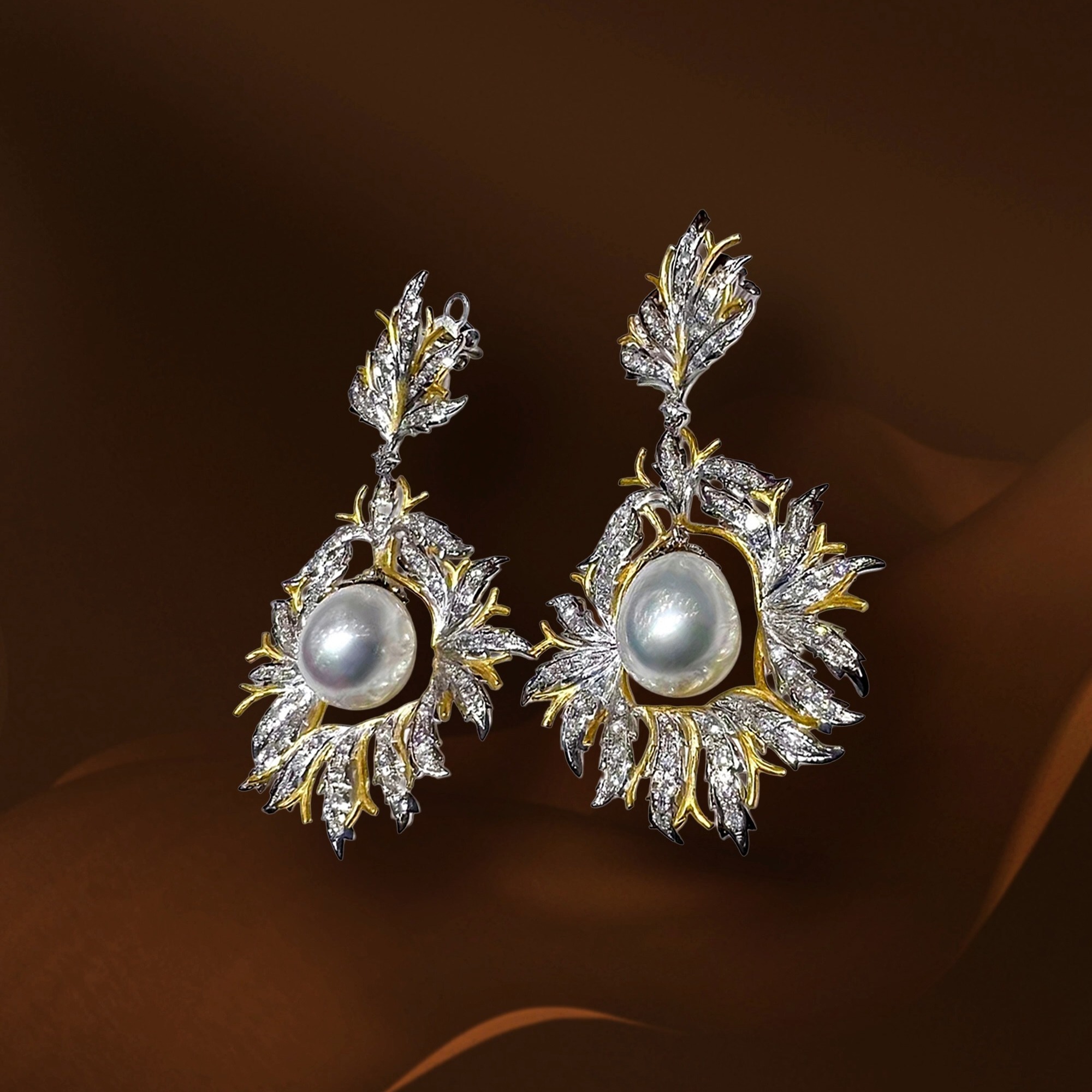 A Crown of Light and Leaves
Like sunlight dancing through gilded leaves, these extraordinary earrings capture nature at its most radiant.
Luminous South Sea pearls rest within a swirling crown of diamond-set foliage, where white and yellow gold intertwine to create movement, brilliance, and depth. Every detail is sculpted to evoke grace in motion — elegant, powerful, and unmistakably timeless.
A statement piece designed not merely to be worn, but remembered.
✨ South Sea Pearls
✨ Natural Diamonds
✨ White & Yellow Gold
✨ Crown Radiance Collection
#ThePearlVogue #SouthSeaPearl #DiamondEarrings #LuxuryJewelry #FineJewelry #PearlJewelry #CrownRadiance