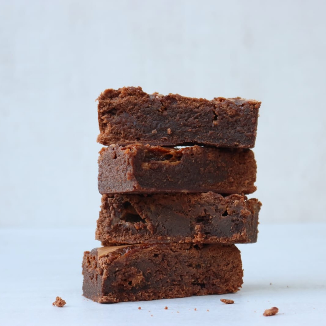 So, we are best-known for our cookies. But honestly, there’s so more to us than cookie dough - we do traybakes too!
Our Salted Caramel Brownie combines rich chocolate brownie with generous swirls of salted caramel (and a touch of LittlePod vanilla, as per usual!)
Fudgy, indulgent and dangerously moreish, it’s one of those bakes that disappears remarkably quickly from café counters.