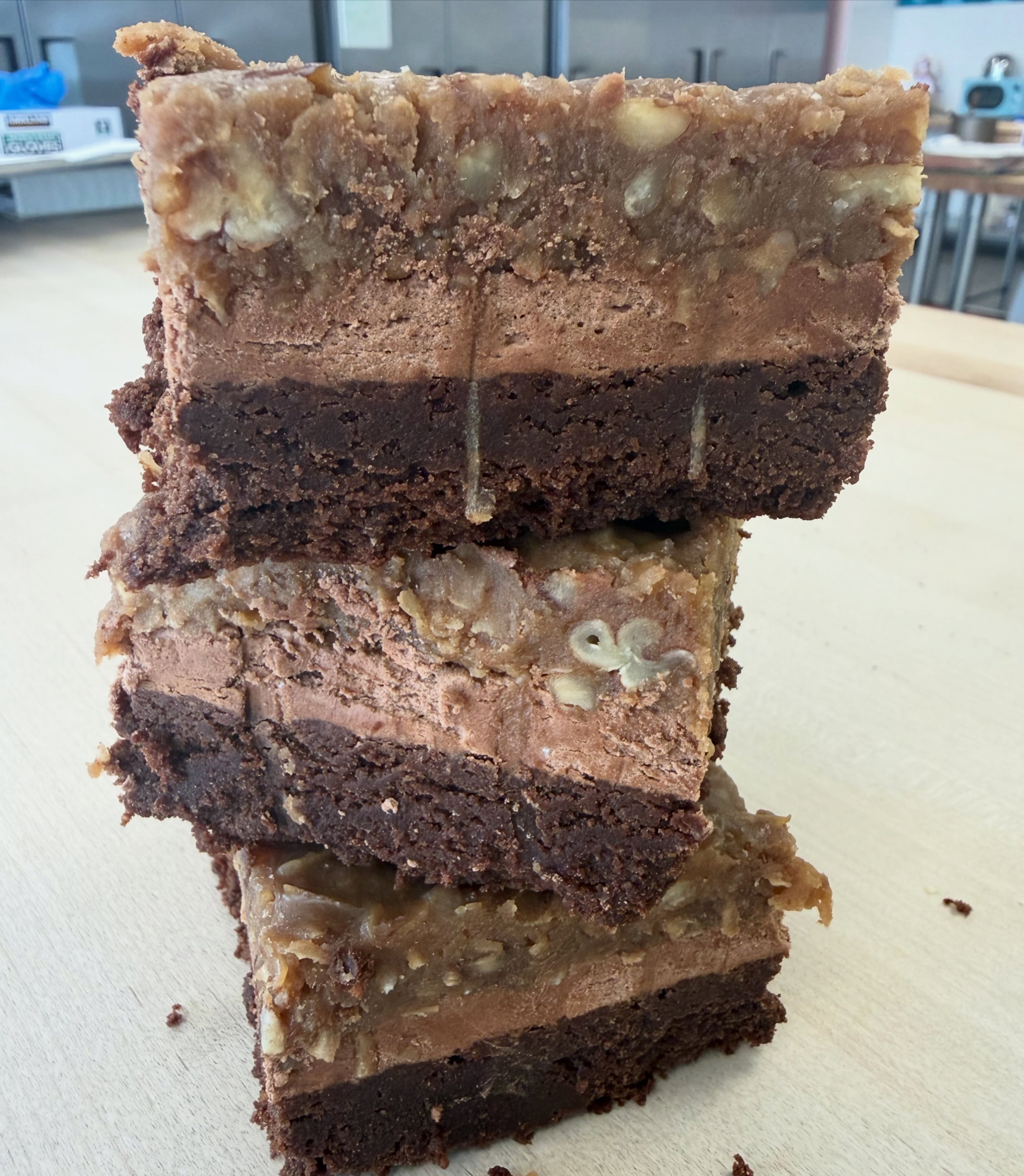 Calling all German chocolate lovers! 🍫😍
Introducing our GLUTEN FREE & SUGAR FREE GERMAN CHOCOLATE BROWNIES!
This indulgent treat starts with our rich, fudgy chocolate brownie, topped with a silky chocolate buttercream and finished with our homemade German chocolate filling. Every bite is packed with the classic flavors you know and love—without the gluten or sugar!
Trust us when we say this one is a game changer. 🤤
If you’re a fan of all things German chocolate, this brownie was made for you! Stop by the bakery and grab one before they’re gone!
Now available in our showcase while supplies last! ❤️🍫✨