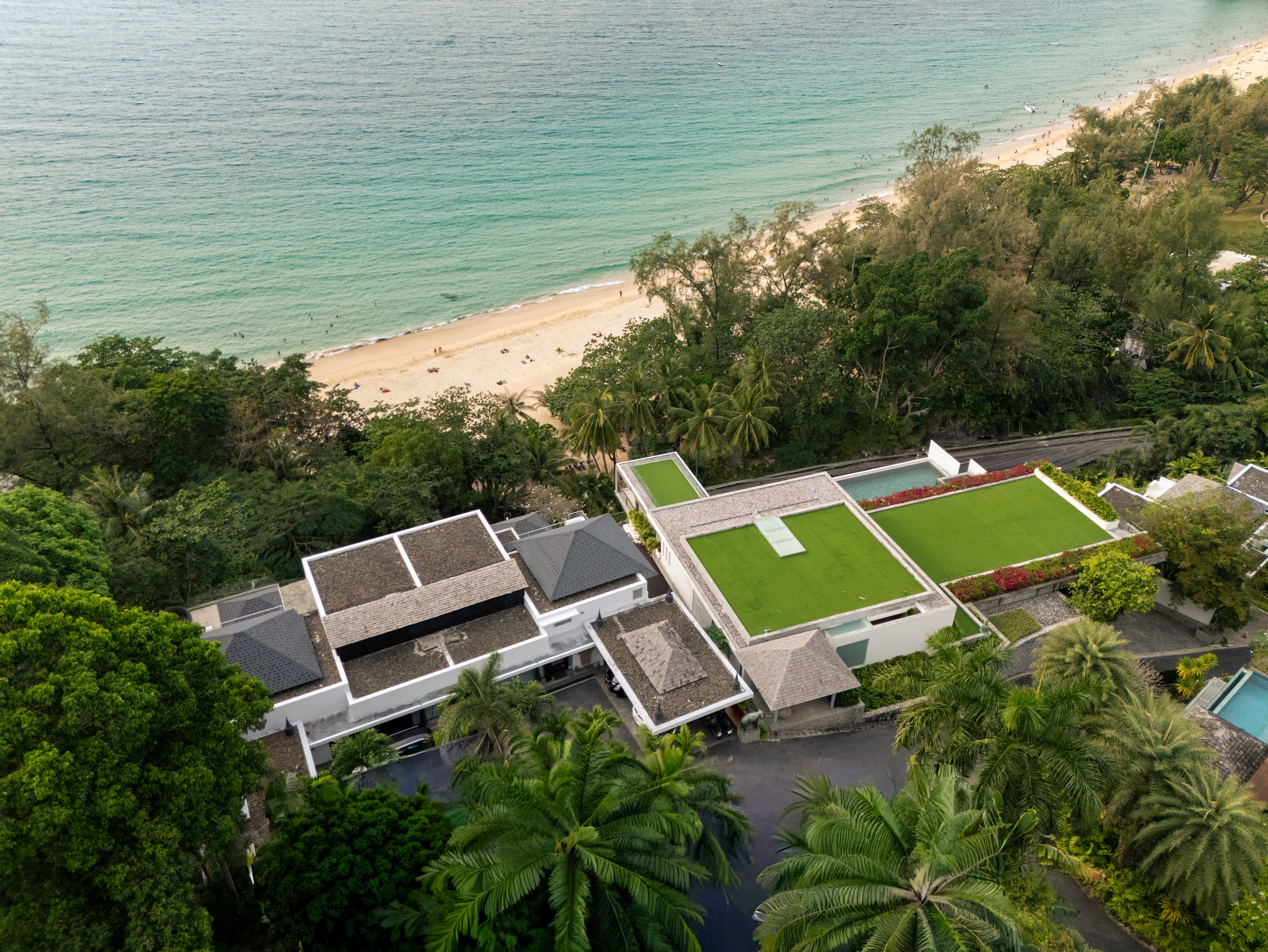 The headland, the villas, the sea that circles everything.