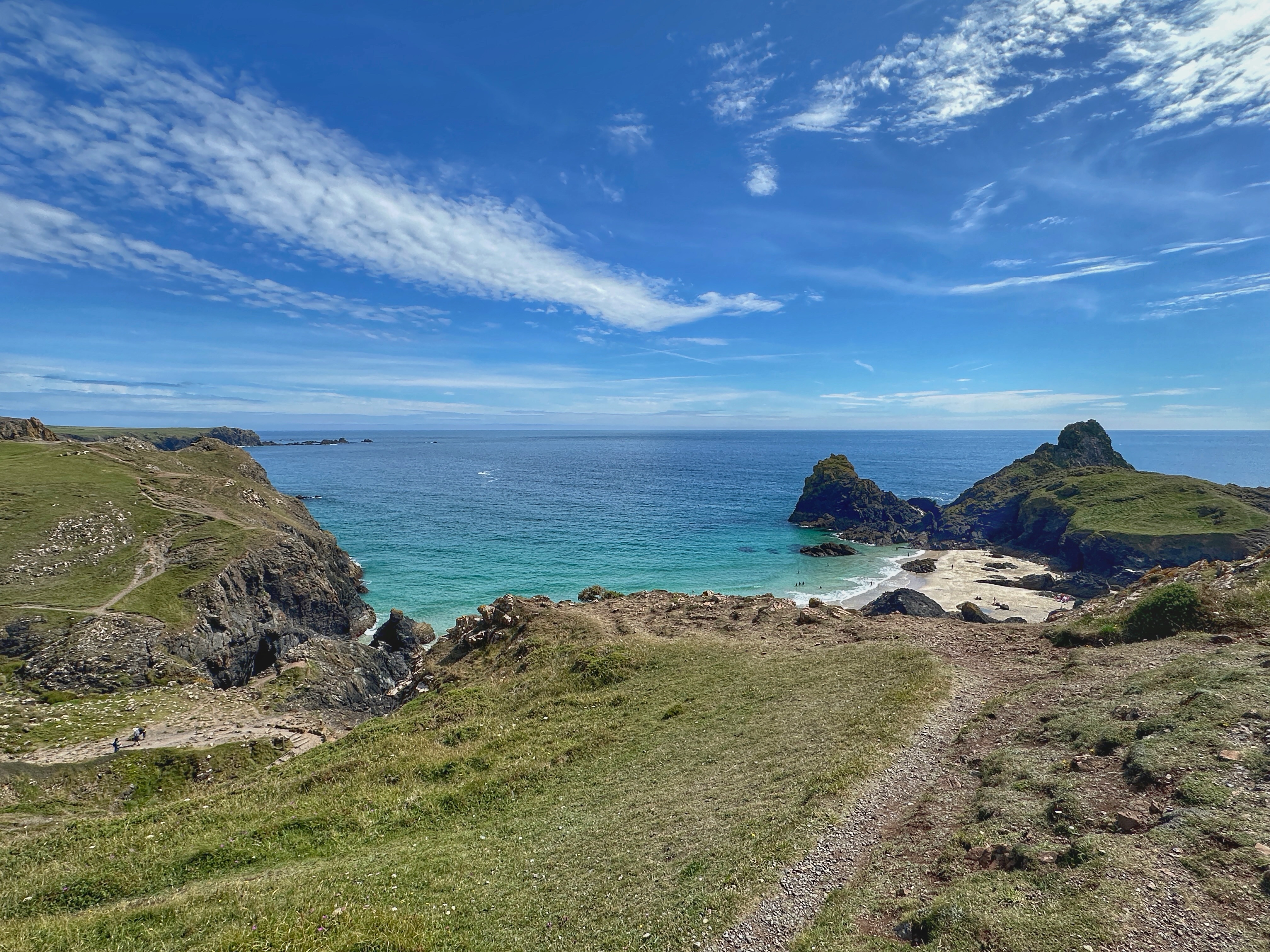 Beautiful conditions for the Geowalk today from Lizard Point walking to Kynance Cove.
These rocks at Kynance are widely serpentine, or strictly serpentinite (a rock full of serpentine minerals). It became a popular ornamental stone thanks to Prince Albert in the 19th Century.
The original rock type, or protolith, is called peridotite, primarily consisting of olivine and pyroxene, depleted in silica, rich in magnesium, and only form in the mantle.
Because they are from the mantle, their instability and dynamic journey to surface means they have been altered, or serpentinised.
Serpentine mineralogy is very complicated, but it does make for some amazing colours. In fact, the the name serpentine comes from how the red and green scaly appearance can look like the skin of reptiles. It is just a complete coincidence that the anglicised version for the local name of the area is called Lizard!
It is also amazing to think that when you’re on the Lizard, you are walking through a section of the Earth’s crust and in to the mantle, where tectonic plates once collided!
400 million years ago, most of Cornwall was situated on a continental shelf on the northern margin of the Rheic Ocean. As the crust continued to stretch apart and thin, oceanic crust began to develop, consisting of heavy mafic/ultramafic igneous rocks.
As tectonic plates began to close this ocean 390 million years ago, the dense oceanic crust was subducted down. The overriding continental plate rising up from the south picked up a chunk of this oceanic crust and upper mantle taking it along for the ride.
Cornwall was caught in the middle of these colliding tectonic plates, and the Lizard Complex helps elucidate this chapter about Cornwall’s geological past.
#kynancecove #cornwall #cornwallgeology #geology #geolife