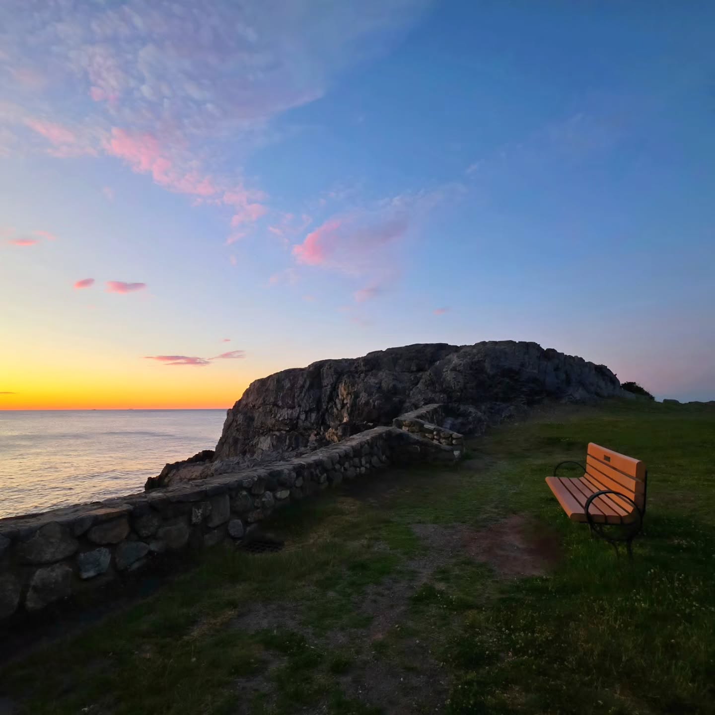 At 5:00 AM on June 20th, I had the incredible honor of officiating a sunrise Norse Pagan Midsommar elopement for Whitney and Emma at Castle Rock in Marblehead... one of my new favorite ceremony spots! As the sun rose over the ocean, we gathered to honor love, share ritual, and welcome the arrival of the summer solstice. There was something truly magical about standing between sea and sky at dawn, with the world still quiet and glowing in golden light. In the five years I've been doing this work, it was honestly one of the most beautiful and magical ceremony experiences I've had. I love helping couples craft meaningful, deeply personal ceremonies... and this one was truly one of a kind. I can't wait to see the photos from one of my favorite collaborators, the amazing @thewitchtographer! 👩🦰☀️🌊🌈✨️