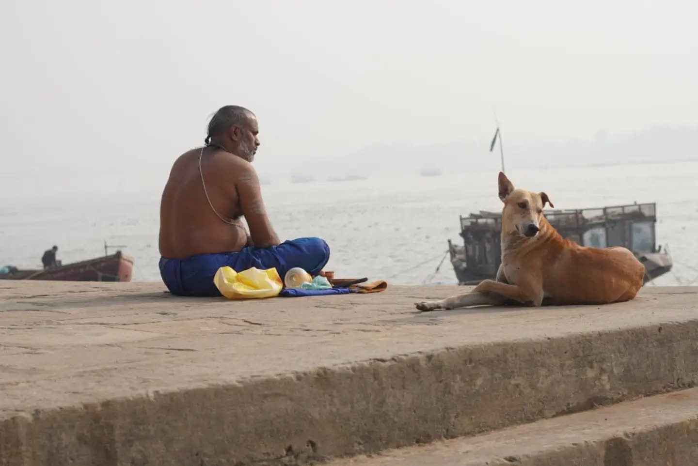 Varanasi doesn't ask you to slow down — it just makes you forget you were ever in a hurry.
The ghats wake up before the sun does. Bells, footsteps, the smell of chai and marigolds, an old boatman humming something older than the city itself. Walk the narrow gullies and you'll get lost — on purpose, if you're smart. Every turn hides a temple, a sweet shop, a wall older than most countries.
This is not a city you visit. It's one you carry with you long after you've left.
#kashi #varanasi #TournivalJourneys #banaras #streetphotography