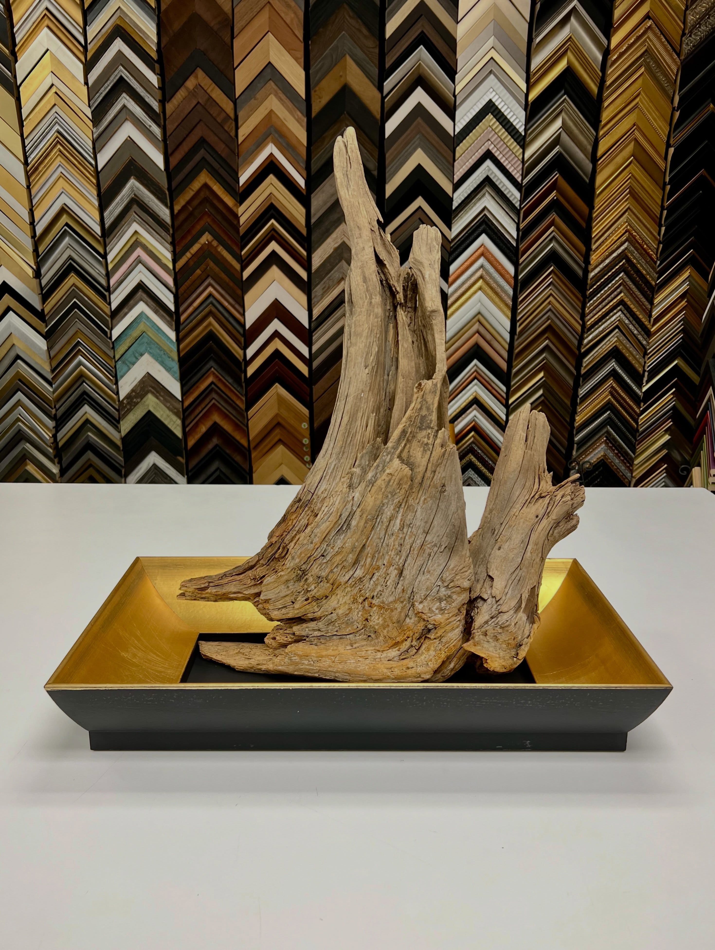 When we say we can frame anything, we mean it. 😤
This sentimental piece of driftwood required a unique approach to framing, making this less of a wall hanging object and more of a statement table centerpiece. The elegant shape of this Palio from @romamoulding almost acts like a bonsai planter and bounces tons of golden light up and across the smoothed wood grain.
Bring us your weird and unconventional objects and we’ll help uplift them into something worth displaying. ✨
#customframing #objectframing #driftwood #goldframe #sentimental