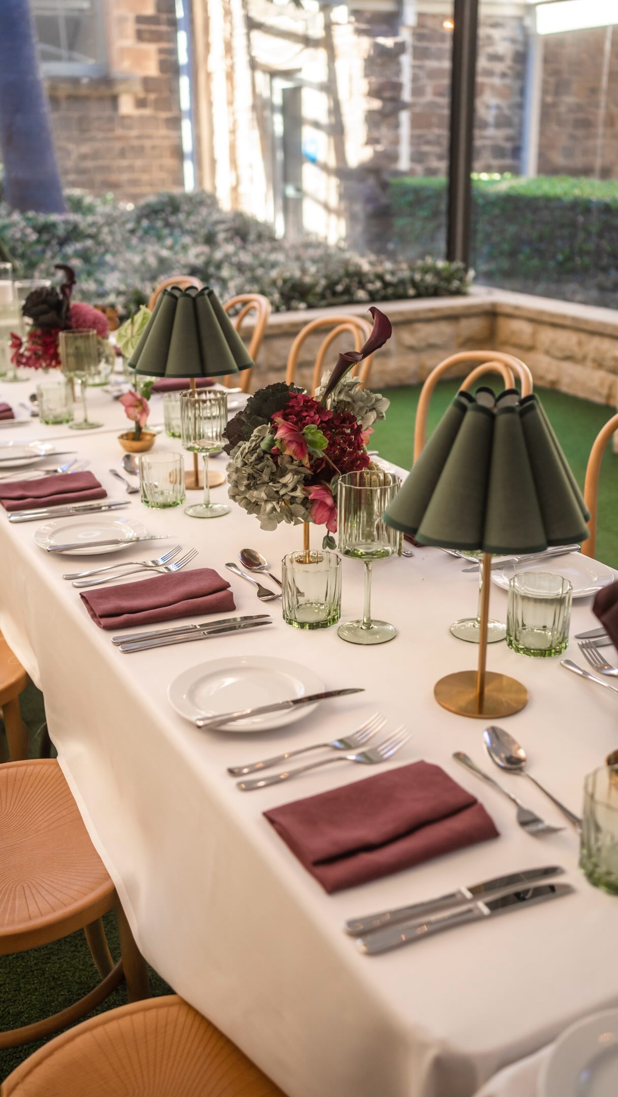 Mulberry. Moss. Rich texture. Moody tones. Texture.
If you’ve been dreaming of a wedding that feels romantic, editorial and just a little bit moody, this colour palette is it. Deep mulberry tones paired with lush mossy greens create a look that feels luxurious, timeless and full of interest. Paired with @socoeventhire styling- this is definite “save to to wedding inspo” moment.
For this design at the Sebel Kiama I Do Open Day, we embraced texture, form and tone to complement the ocean backdrop. It’s a palette that feels interesting and creates a vibe.
If you’re searching for a venue that offers stunning ocean views, beautiful accommodation for your guests and a relaxed coastal atmosphere, The Sebel Kiama is well worth adding to your list.