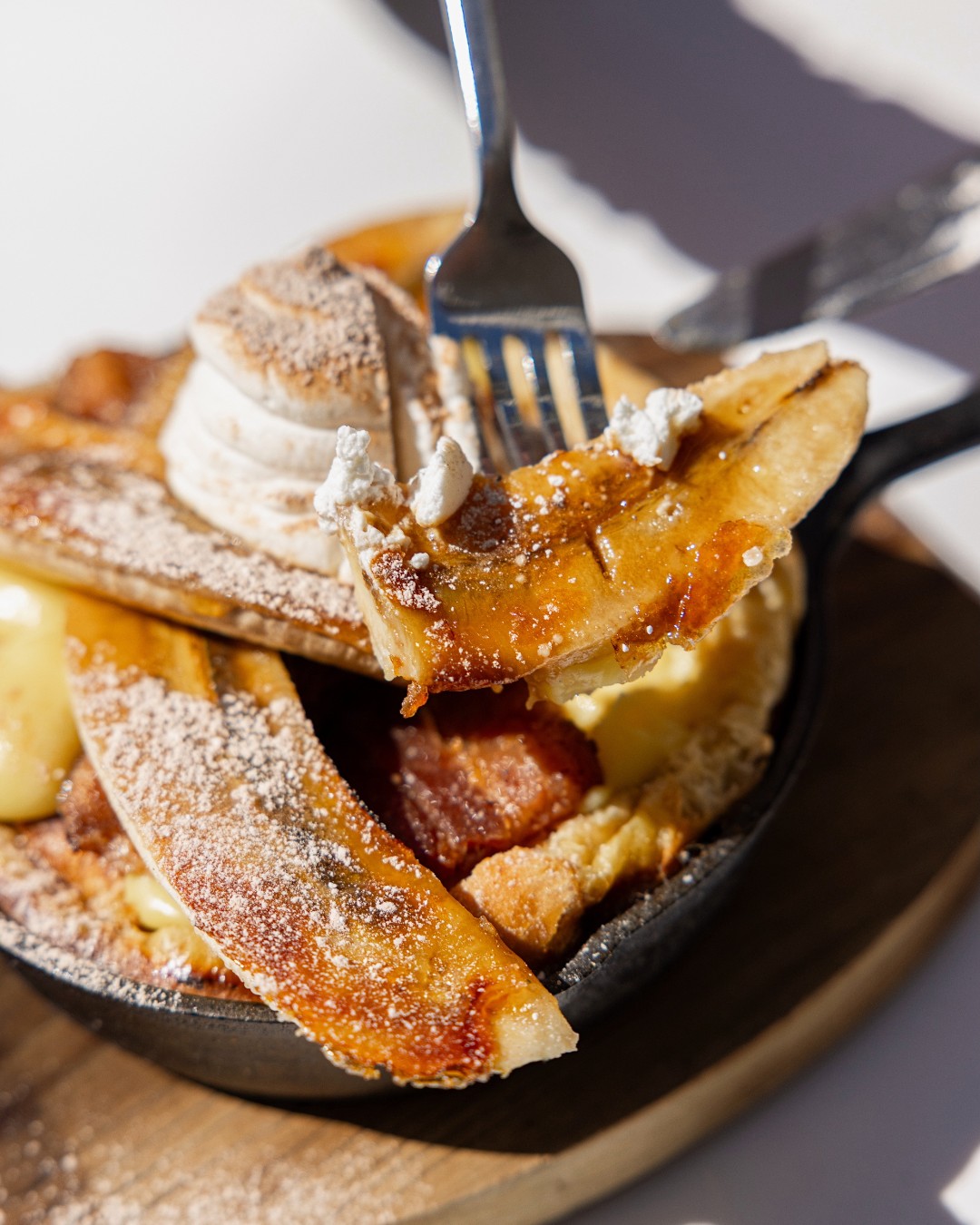 pure brunch bliss in every bite 🍌baked banana brûlée french toast topped with caramel, salt....