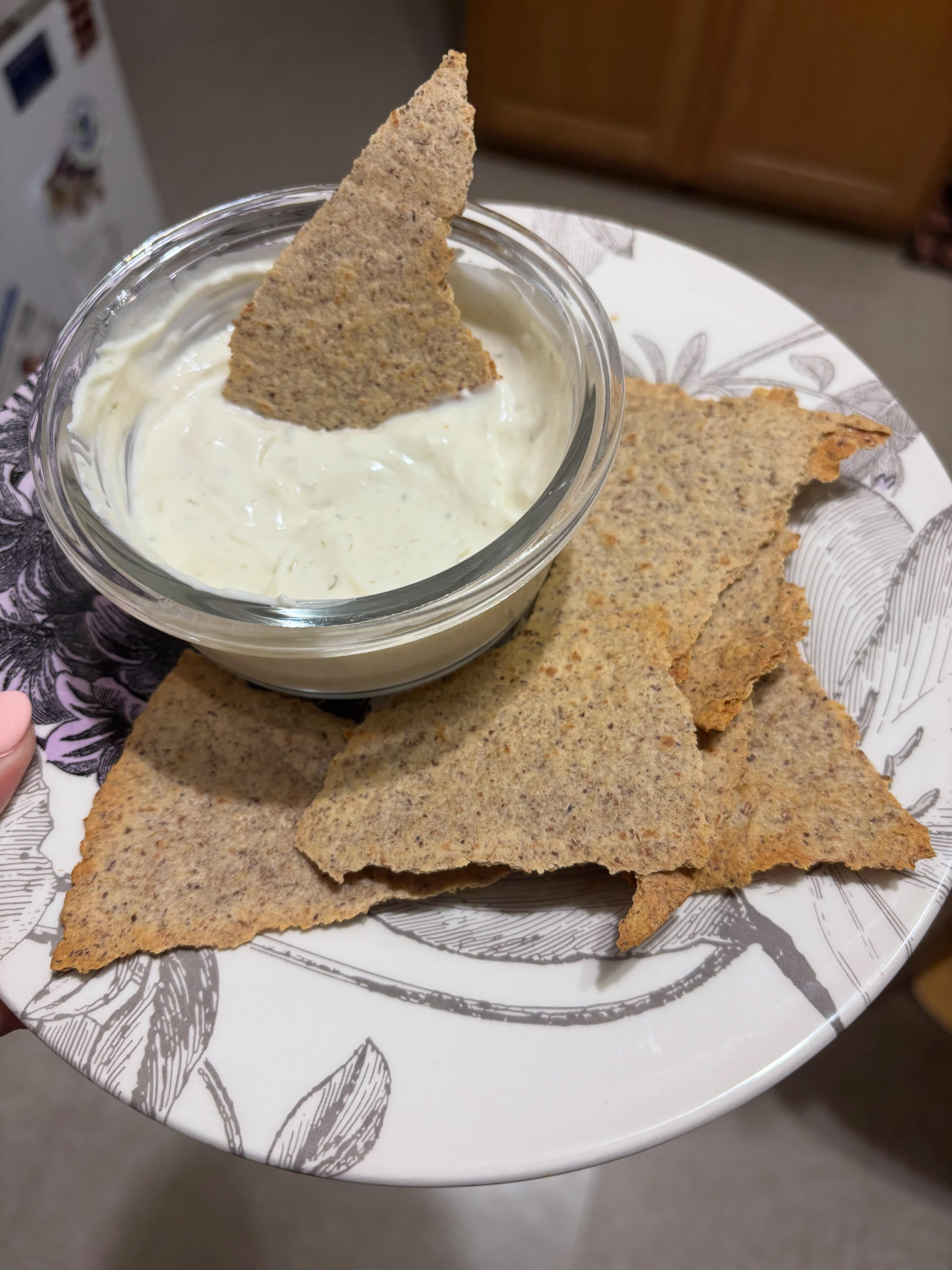 High Protein Zesty Parmesan Dip & Chips
Nurse Kellieās go to night snack lately š
Ingredients
* 1 Lāoven Fresh Protein Wrap, ripped up and air fried into chips
* 3 tbsp Happy Farms Chive & Onion Cream Cheese Spread
* 32 g Oikos Triple Zero Plain Greek Yogurt
* 2 scoops Parmesan Cheese @mealboosters Powder
Directions
1. Air fry the protein wrap at 375°F for about 5 to 7 minutes, flipping halfway, until golden and crisp. Let cool for a minute to become even crunchier.
2. Mix the cream cheese, Greek yogurt, and parmesan protein powder until smooth. If it is too thick, stir in 1 to 2 teaspoons of water or milk until it reaches your preferred consistency.
3. Serve the dip with the wrap chips.
~Macros
* Calories: 345
* Protein: 38 to 40 g
* Carbohydrates: 18 to 22 g
* Fiber: 10 to 12 g
* Net Carbs: 8 to 12 g
* Fat: 12 to 14 g
For even more flavor, mix in:
* Everything bagel seasoning
* Garlic powder
* Black pepper
* Fresh chives
* Ranch seasoning (low sodium)
* A squeeze of lemon juice
* Hot sauce for a spicy version
This is the kind of snack that keeps you full for quite a while because it combines a high protein intake with plenty of fiber and a satisfying crunch.
Give it a try!
#protrin #fiber #abetterpathtowellness #mealboosters #dip
