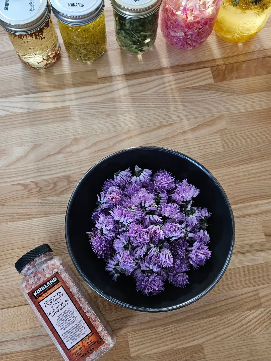 Chive blossom salt πΏ
2 cups chive blossoms
1 1/4 cup course Himalayan salt
β’ Add to a blender or food processor and pulse until the chive blossoms are broken up. Open the lid carefully - it will be potent!!
β’ Spread into a thin layer on a cookie sheet lined with parchment paper.
β’ Dehydrate on 100Β°F for around 6-8 hours or until all the moisture has evaporated out. I used the dehydrate setting on my oven. Stir + mix around every hour or so to make sure the moisture is released evenly. Break up larger chunks so the moisture can escape.
β’ Remove from oven and let cool.
β’ You can re-pulse the dried salt in your food processor or blender to break up any small chunks.
β’ Store in an airtight container.
This ratio of salt to blossoms gives a potent onion-flavoured salt! It's great on sautΓ©ed or roasted veg, meat, in homemade dips + dressings, or in scrambled eggs. Enjoy!
