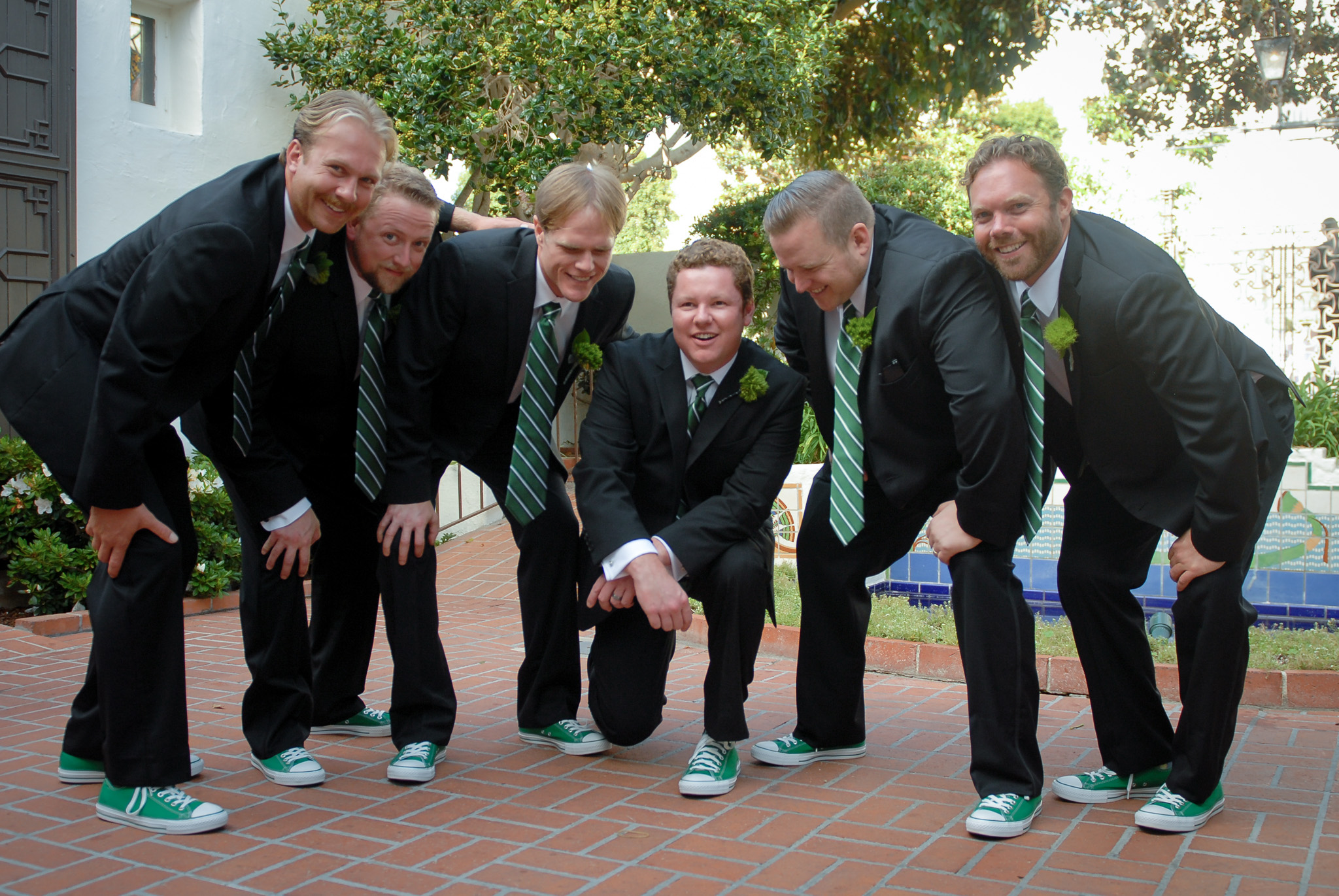 Green ties, matching kicks, unbeatable crew. #groom #groomsmen #weddingday #wedding #weddinginspiration #weddingphotographer #weddingphotography #ovationphotographyanddesign #weddingpic #weddingbells #bestman