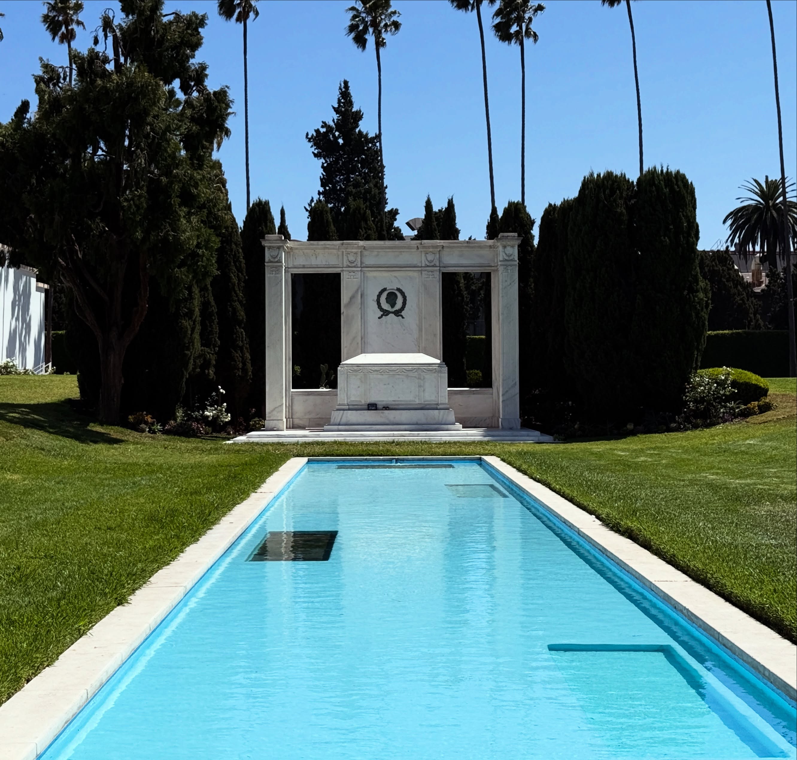The reflecting pool is nice and clean at the tomb of Douglas Fairbanks, and Douglas Fairbanks Jr, both action stars and swashbuckling heroes of the early silver screen.