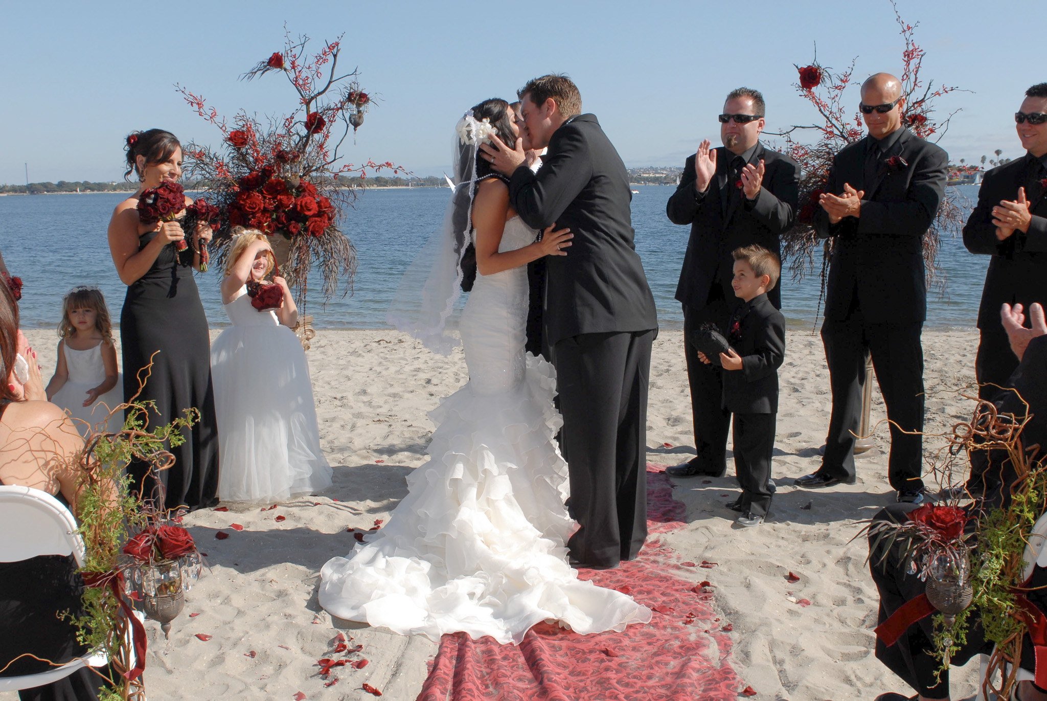 Sealed with a kiss by the shore. 🌊💍 Forever starts right here. #beachwedding #firstkiss #weddingphotographer #justmarried #brideandgroom #weddingday #wedding #weddingphotography #ovationphotographyanddesign #destinationwedding #weddinginspiration