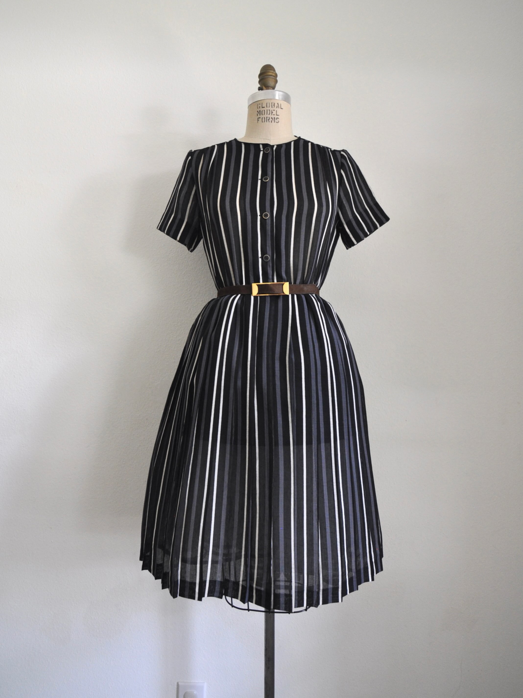 🩵SOLD🩵Black white and gray striped dress. Feels like chiffon blend, elastic waist, functional buttons. Bust: 36-38” Waist: 30-35” Length: 41” Shoulder to waist: 16” Sleeve Width: 12”
