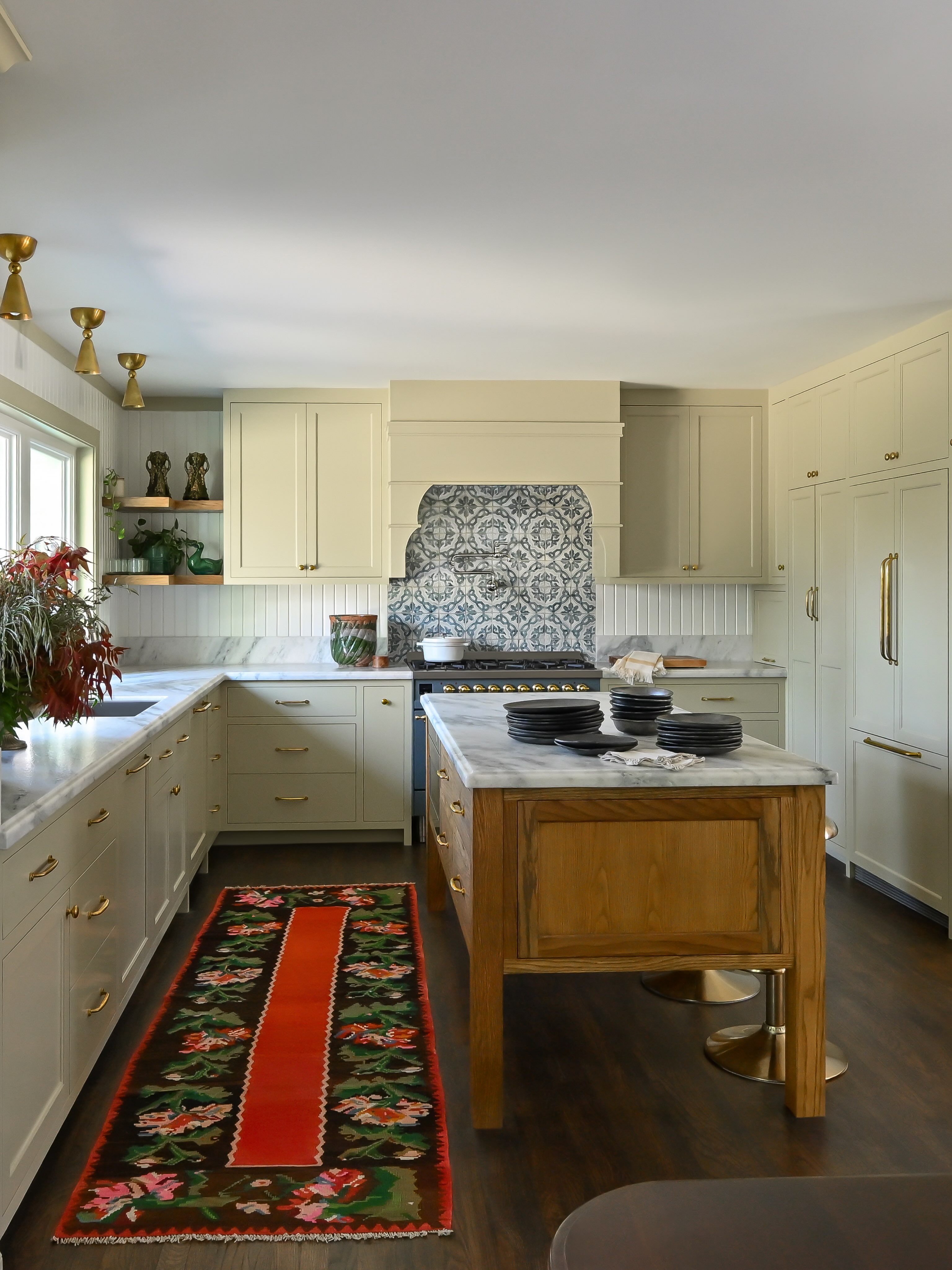 Sometimes the biggest opportunity in a home is simply rethinking how the spaces live together.
For our Eclectic Cottage, that meant moving the kitchen from one end of the home to the other. Originally, you walked through the front door and straight into the kitchen, which never felt quite right. By relocating it closer to the dining room and opening it up to the living spaces, the whole home began to make more sense.
Now, rooms that once felt separate flow naturally into one another, and the heart of the home is right where it should be. Connected, welcoming, and made for cooking, gathering, and everyday life.