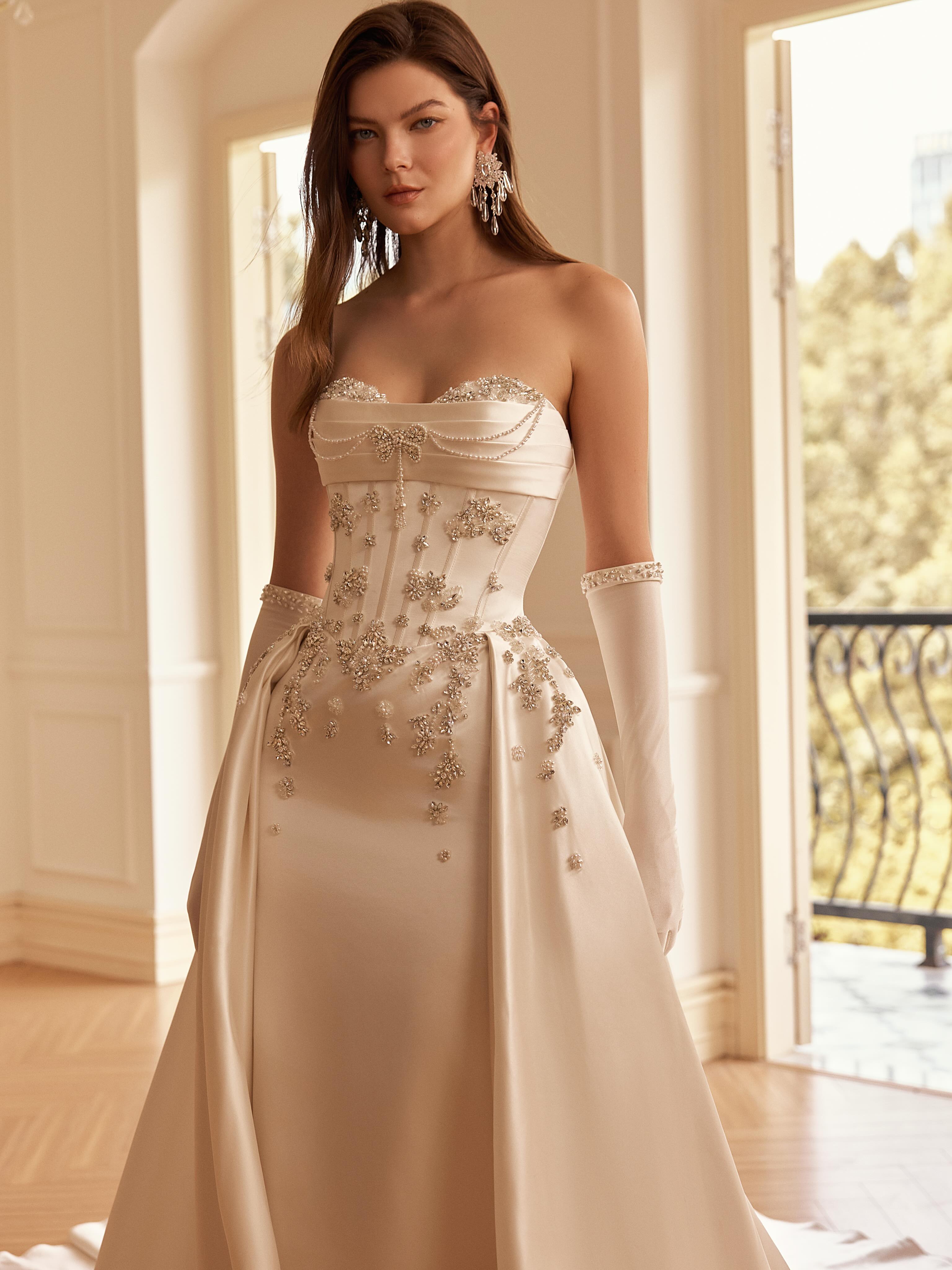 Meet Esmée — made for the bride who wants to be unforgettable. ✨
A sculpted corset bodice adorned with intricate crystal embellishments, delicate pearl draping, and a luminous satin silhouette that flows into a dramatic train.
Romantic. Regal. A little unexpected.
Esmée is now available to try on at Cherie Amor Bridal in Orange County. 🤍
2027 brides, would you try her on?
📍 Cherie Amor Bridal | Orange County, CA
💍 Book your bridal appointment — link in bio
#orangecountybride #weddingdressorangecounty #ocbridalboutique #2027weddingdress #2027bride