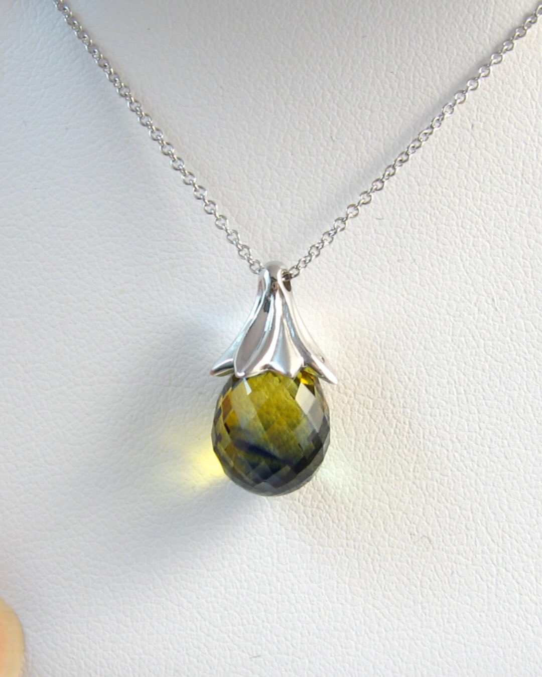 What’s a parti-colored sapphire? This ⬆️ A sapphire that naturally shows multiple colors at once. This one shifts between yellow, blue, and green, with incredible clarity to match. 💙💚💛
✨
This necklace was created as a push present for a colleague’s wife after the birth of their September baby, so naturally, sapphire was the stone of choice.
✨
I sourced this beautiful sapphire briolette without fully realizing at the time just how special it was. Large, remarkably clean, and with three distinct zones of color, it immediately inspired the design: a cap of white gold petals radiating from the top, with the chain passing seamlessly through.
✨
She loved it, and somehow, this is the only photo I took before handing it off!
✨
Thinking about creating a special piece of jewelry just for you? Send me a message. I’d love to help bring it to life. ✨